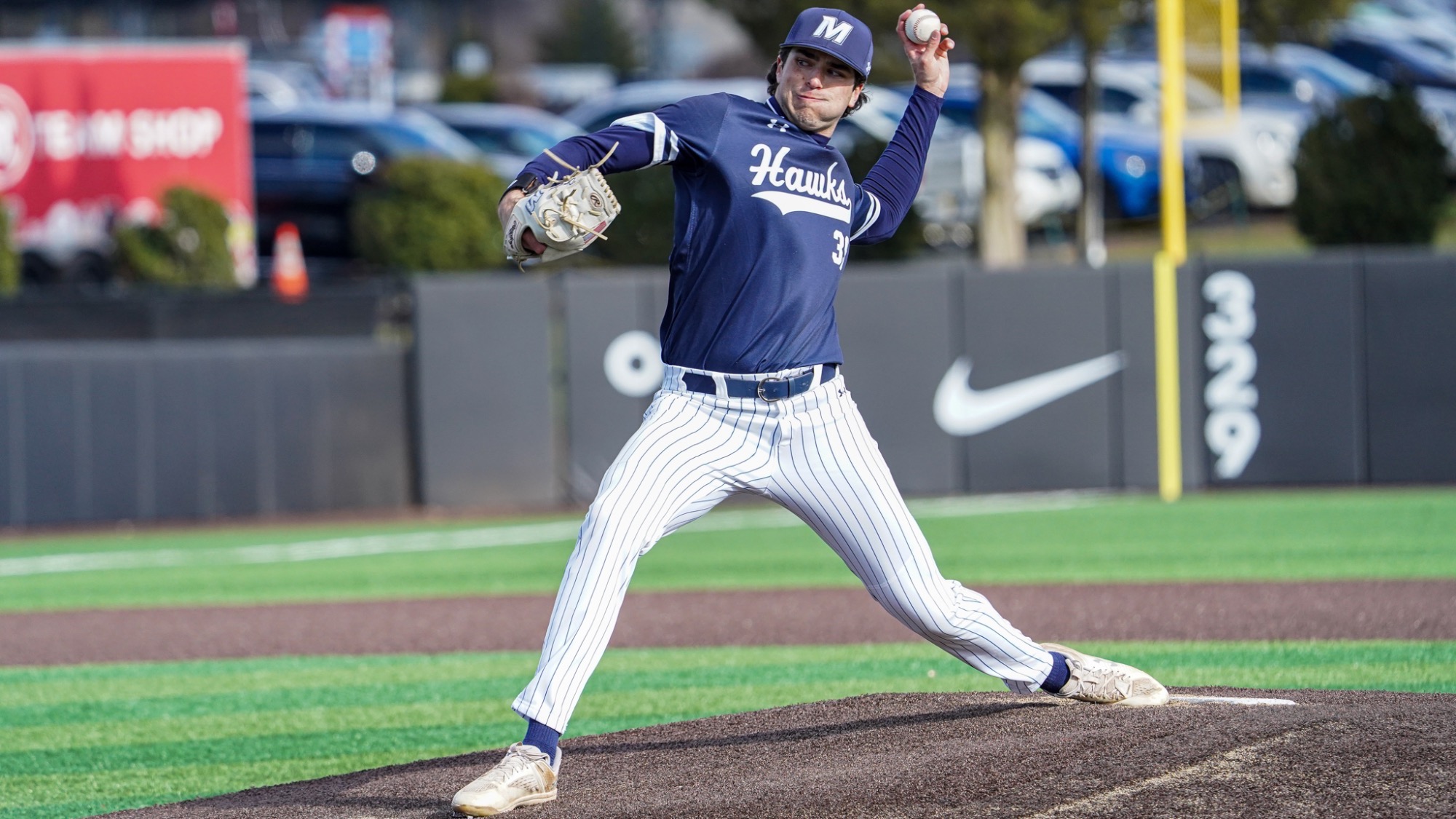 Jake Danyluk pulls his arm back to throw a pitch