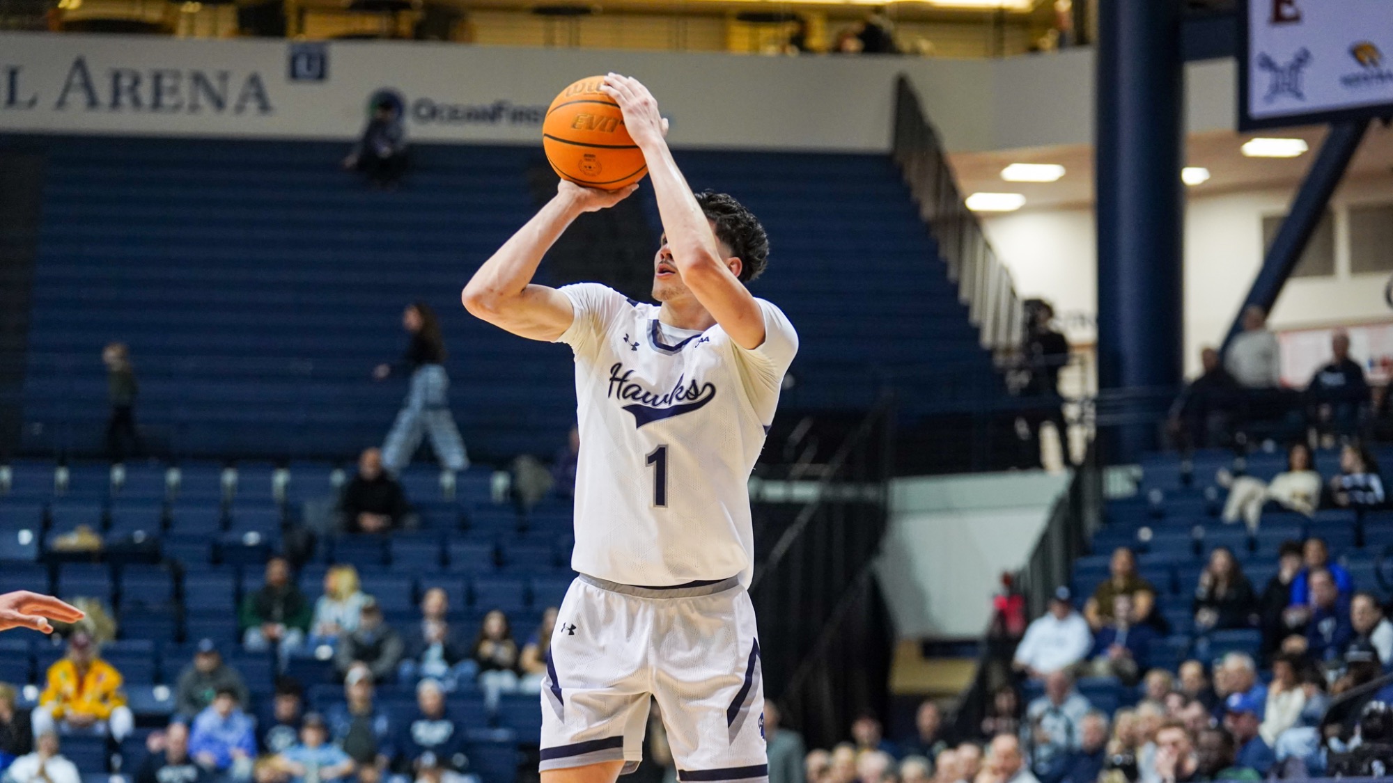 Jason RIvera-Torres holds the ball above his head ready to shoot