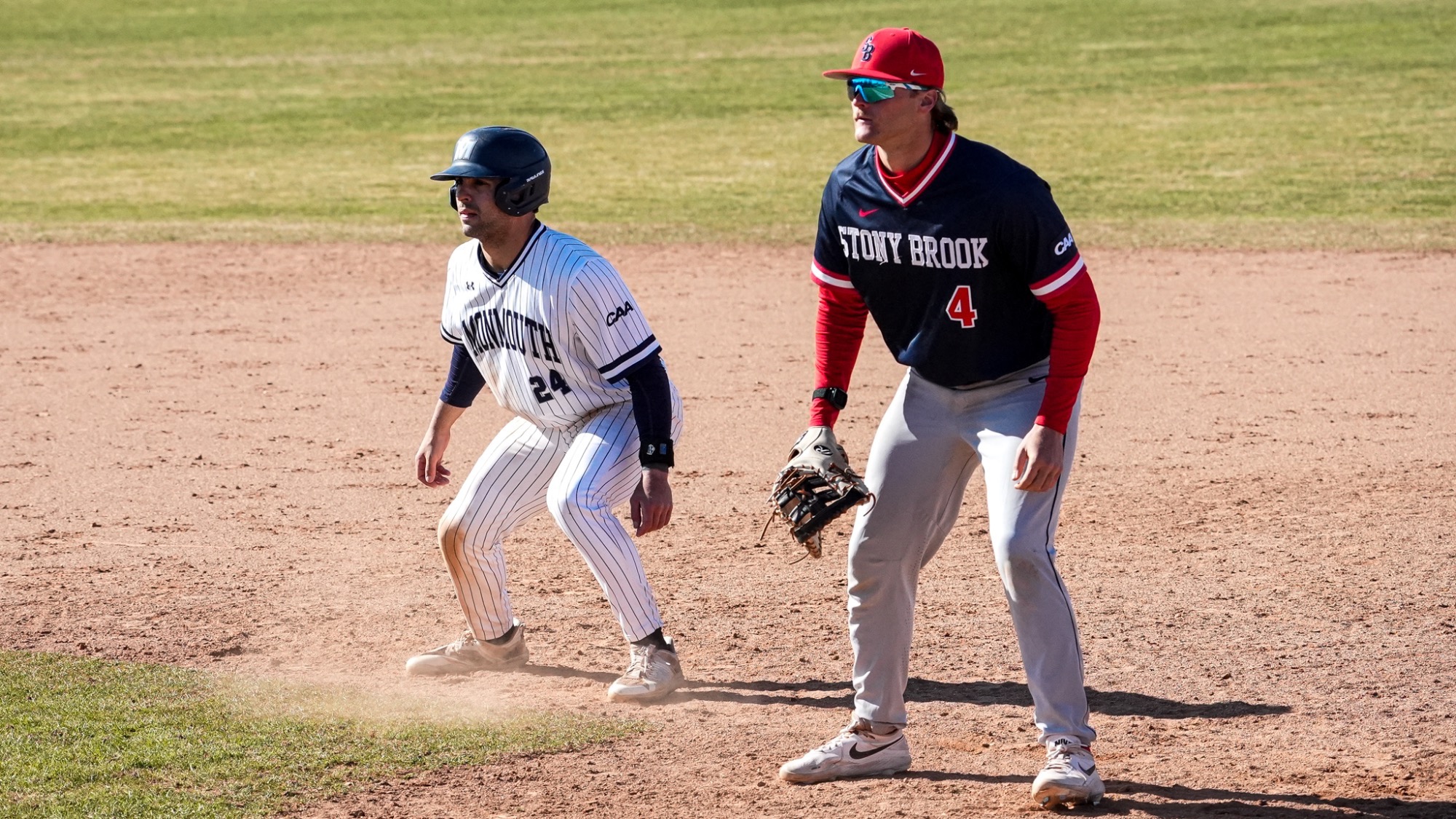 Nick Lovarco leads off first base as the first baseman looks on