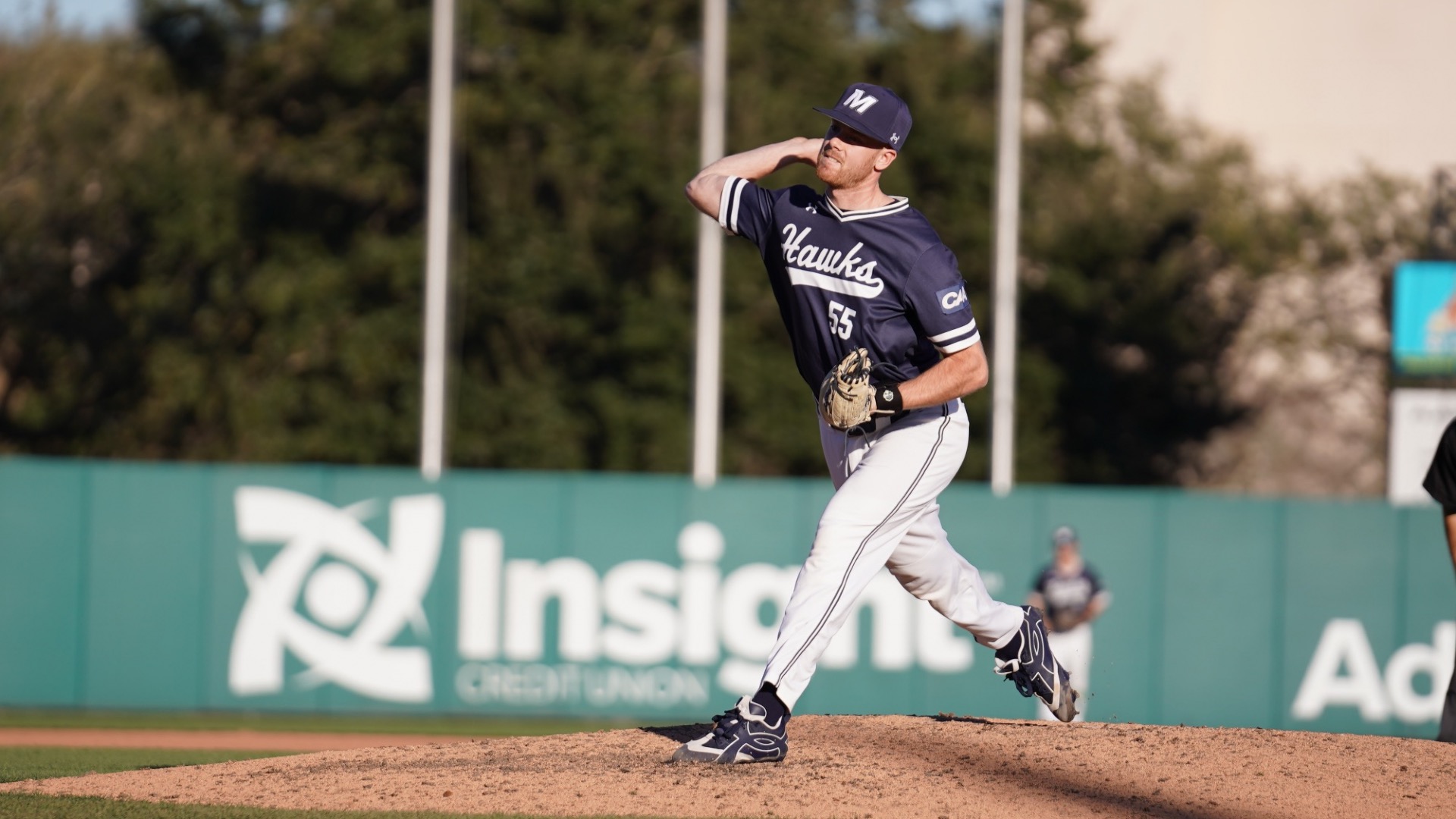 David Horvath brings his arm forward to throw a pitch