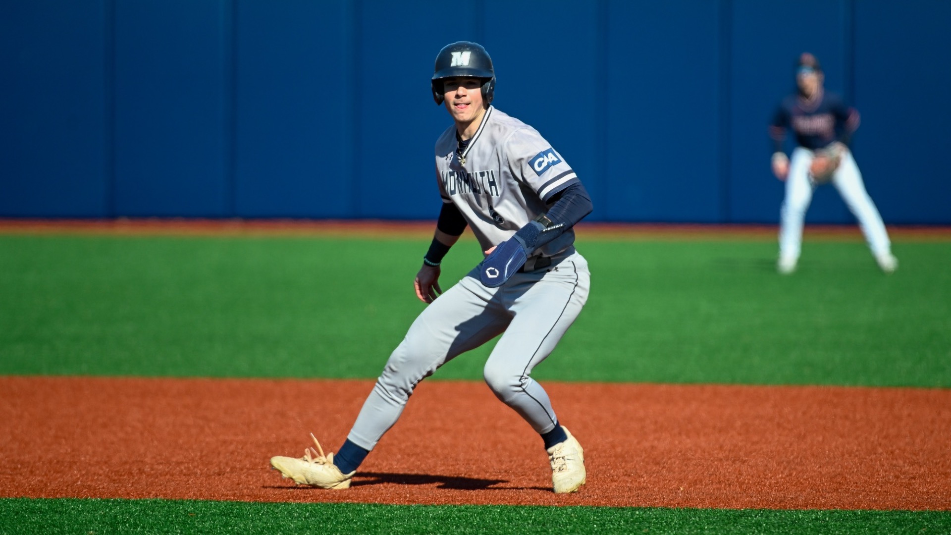 Chris Walsh leans to one side as he leads off first base