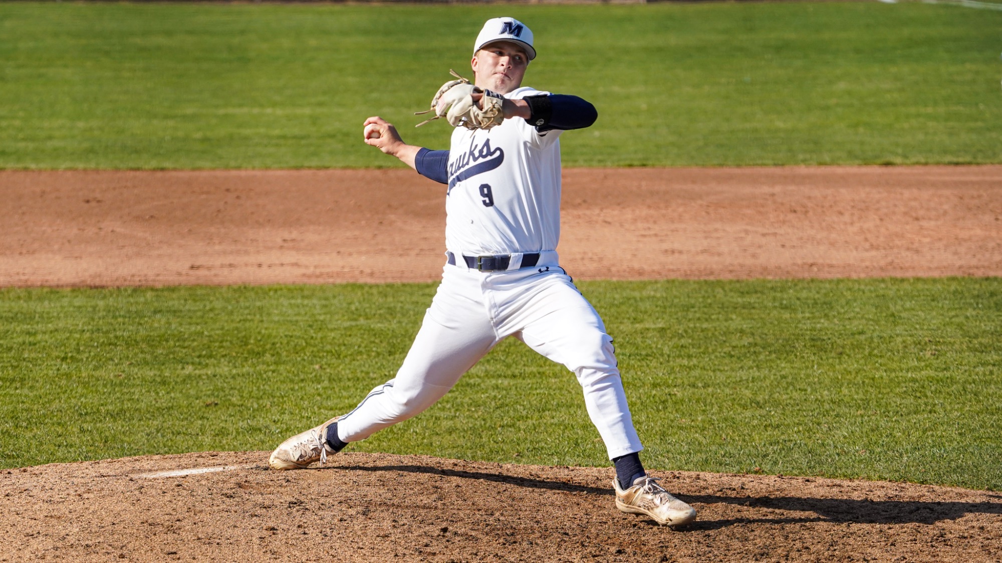 Ryan Mealy reaches back to throw a pitch