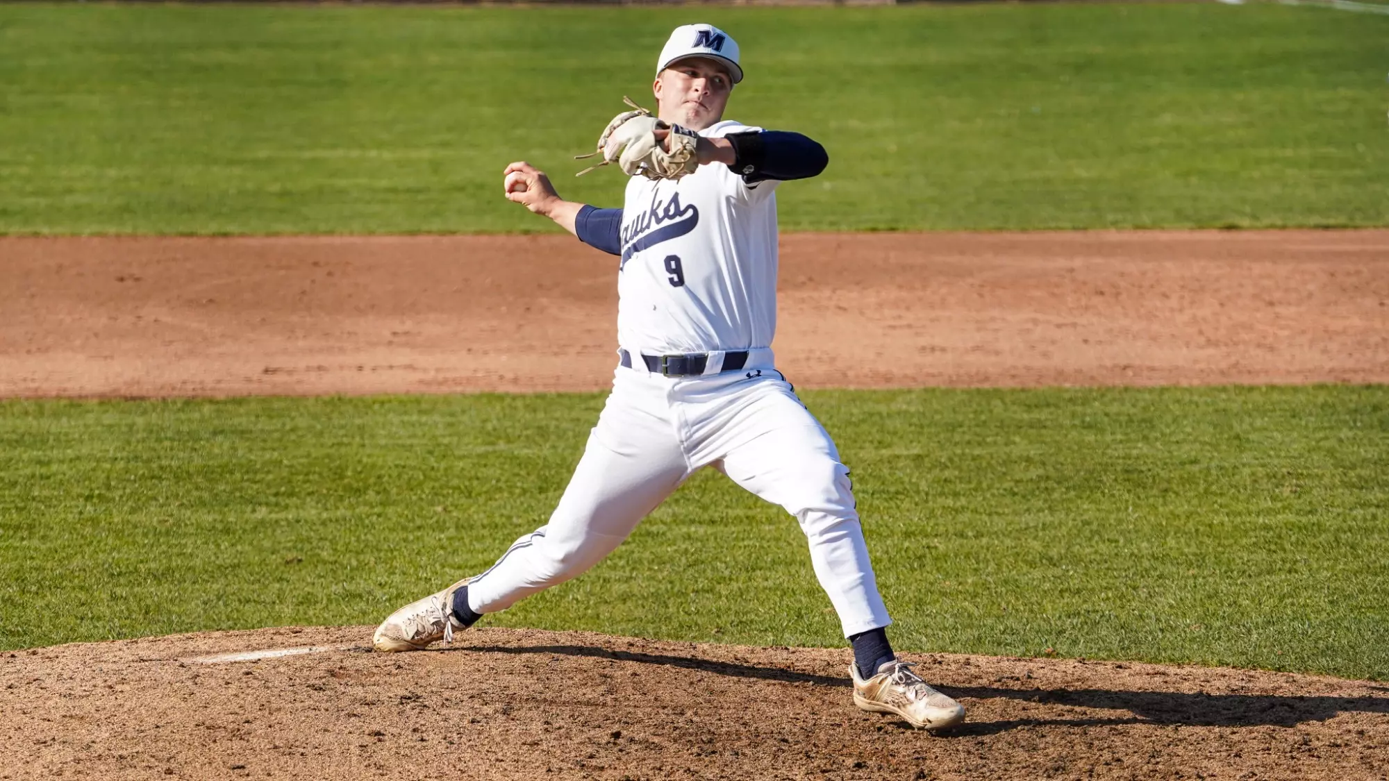 Ryan Mealy reaches back to throw a pitch