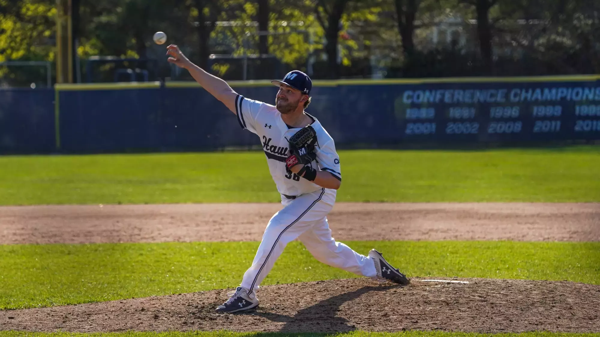 Jake Nolan is mid delivery on a pitch