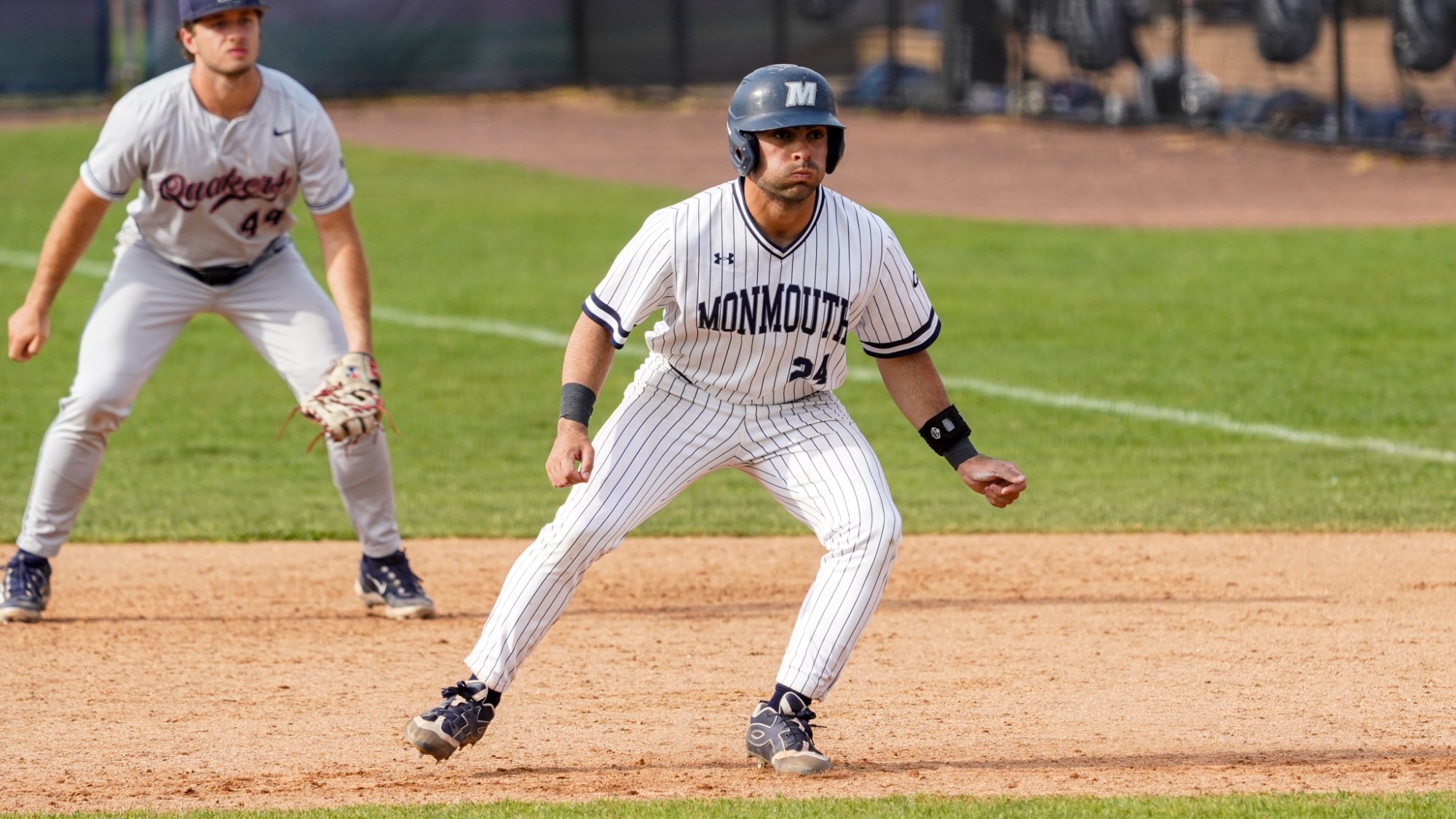 Nick Lovarco leads off first base with a defender behind him