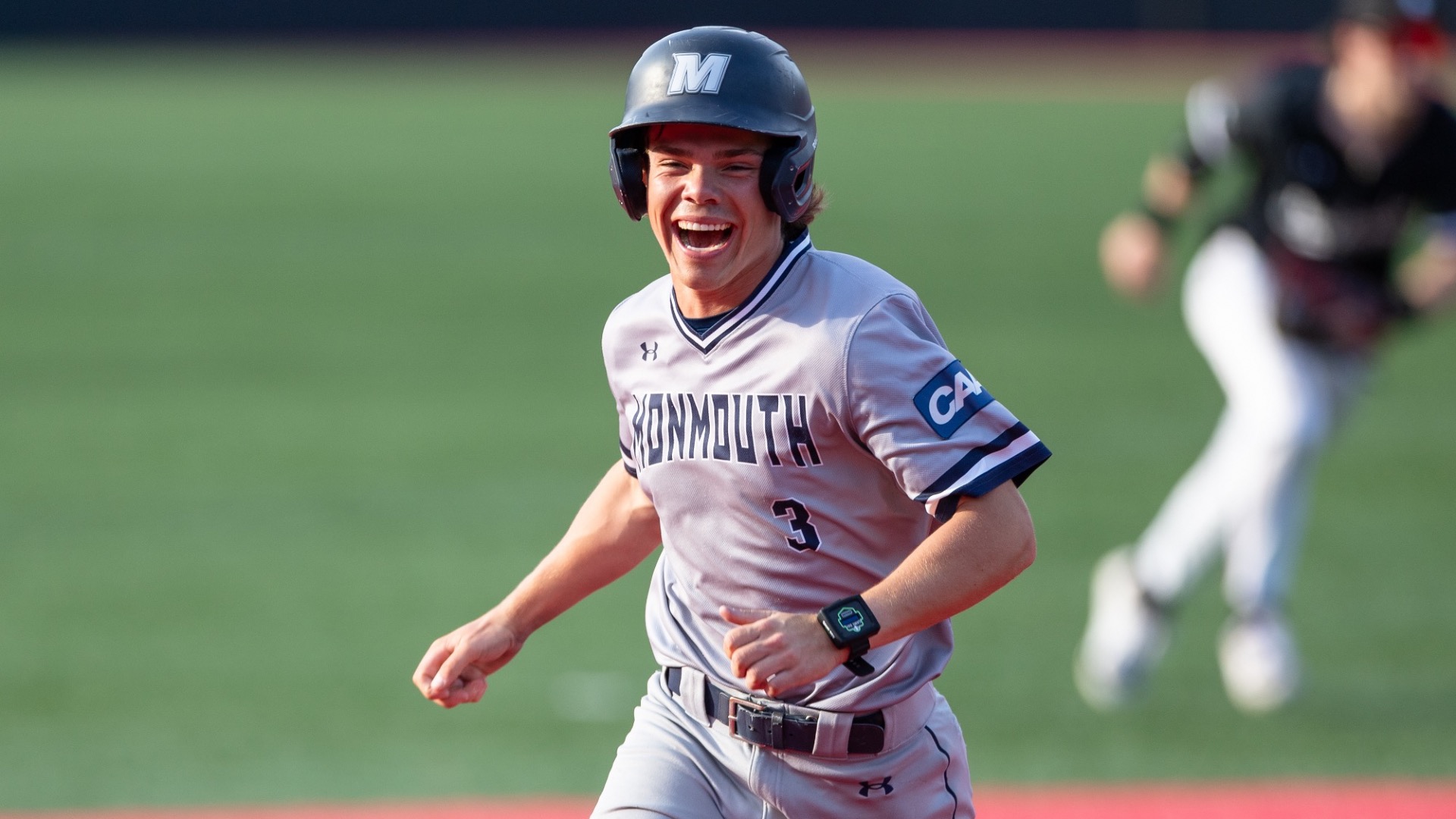 Wyatt Hunt smiles as he runs around the bases