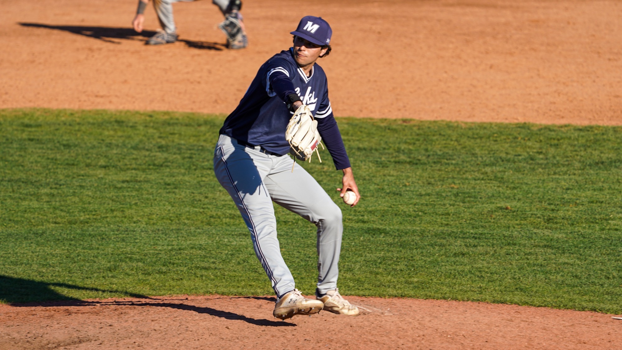 Jake Danyluk leans in to throw a pitch