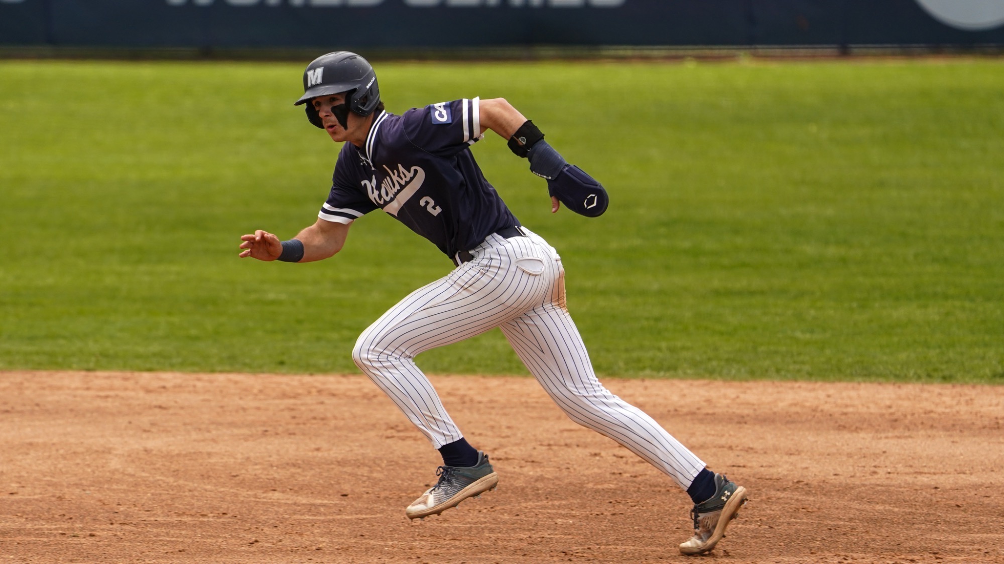 Chris Walsh mid stride as he runs the bases