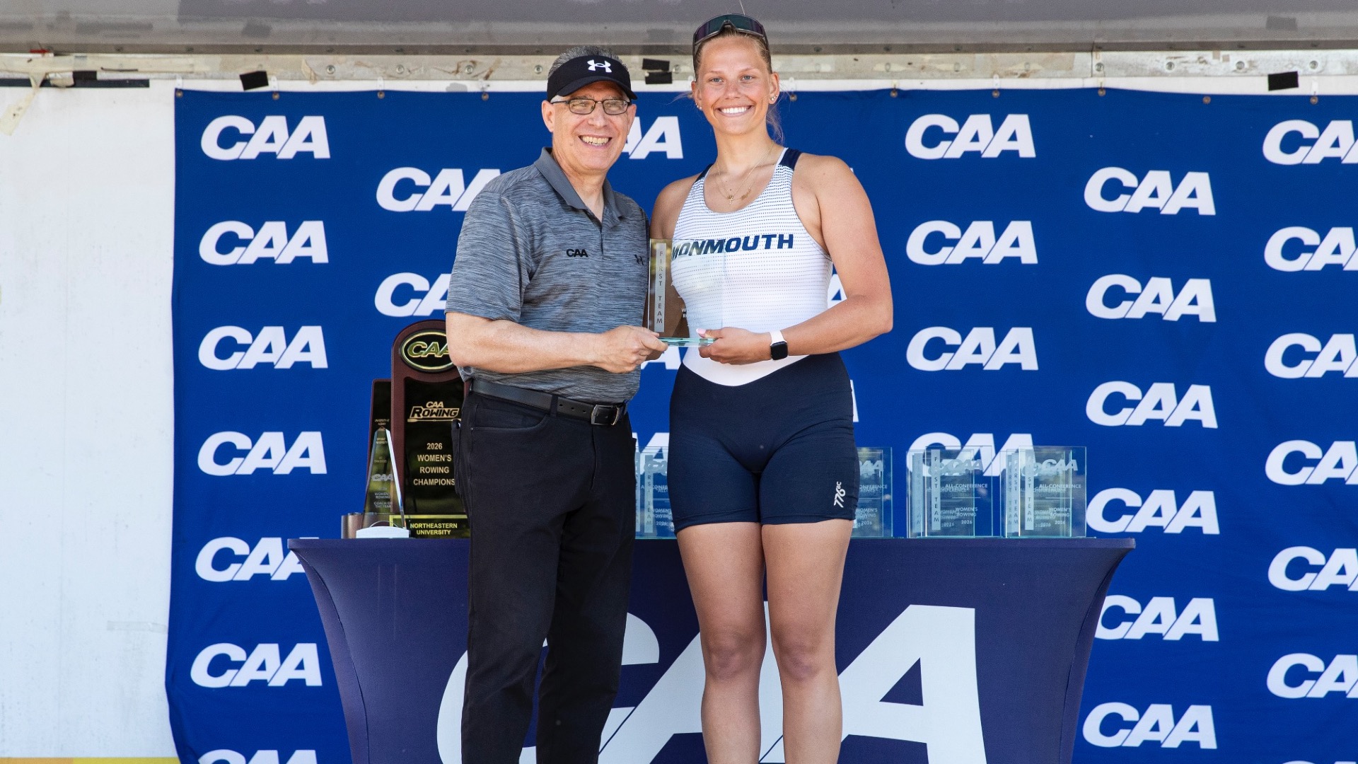 Alyssa Taylor and CAA Commissioner D'Antonio with All-CAA plaque