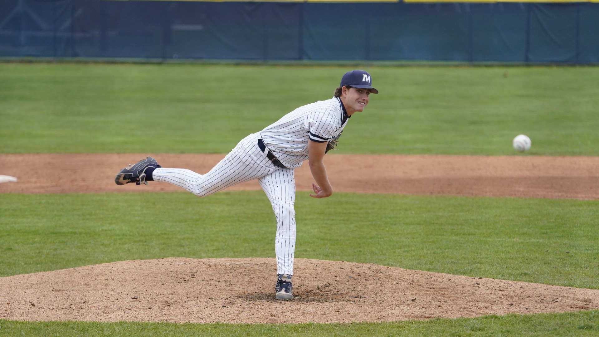 Austin Beard leans in as he delivers a pitch