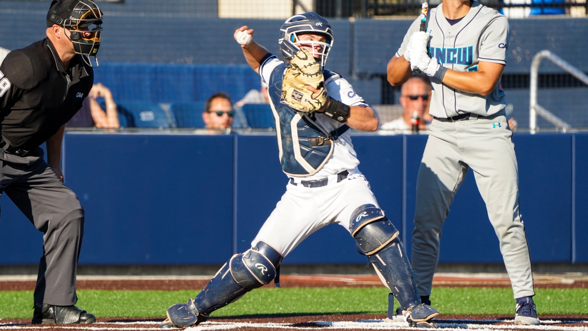 Brendan Buecker steps on the plate and prepares to throw the ball to second