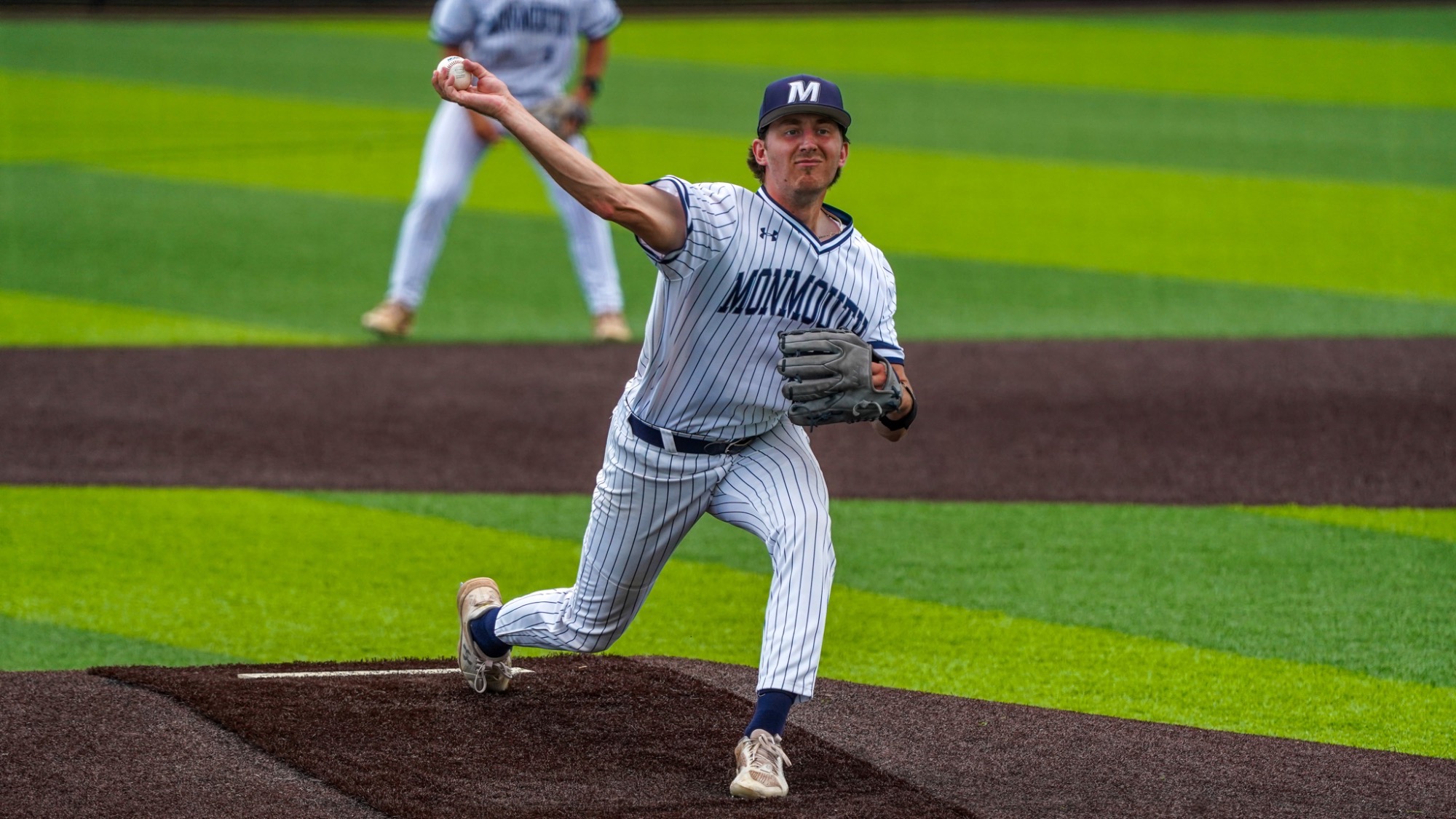 Alec Couture pulls his arm back to throw a pitch