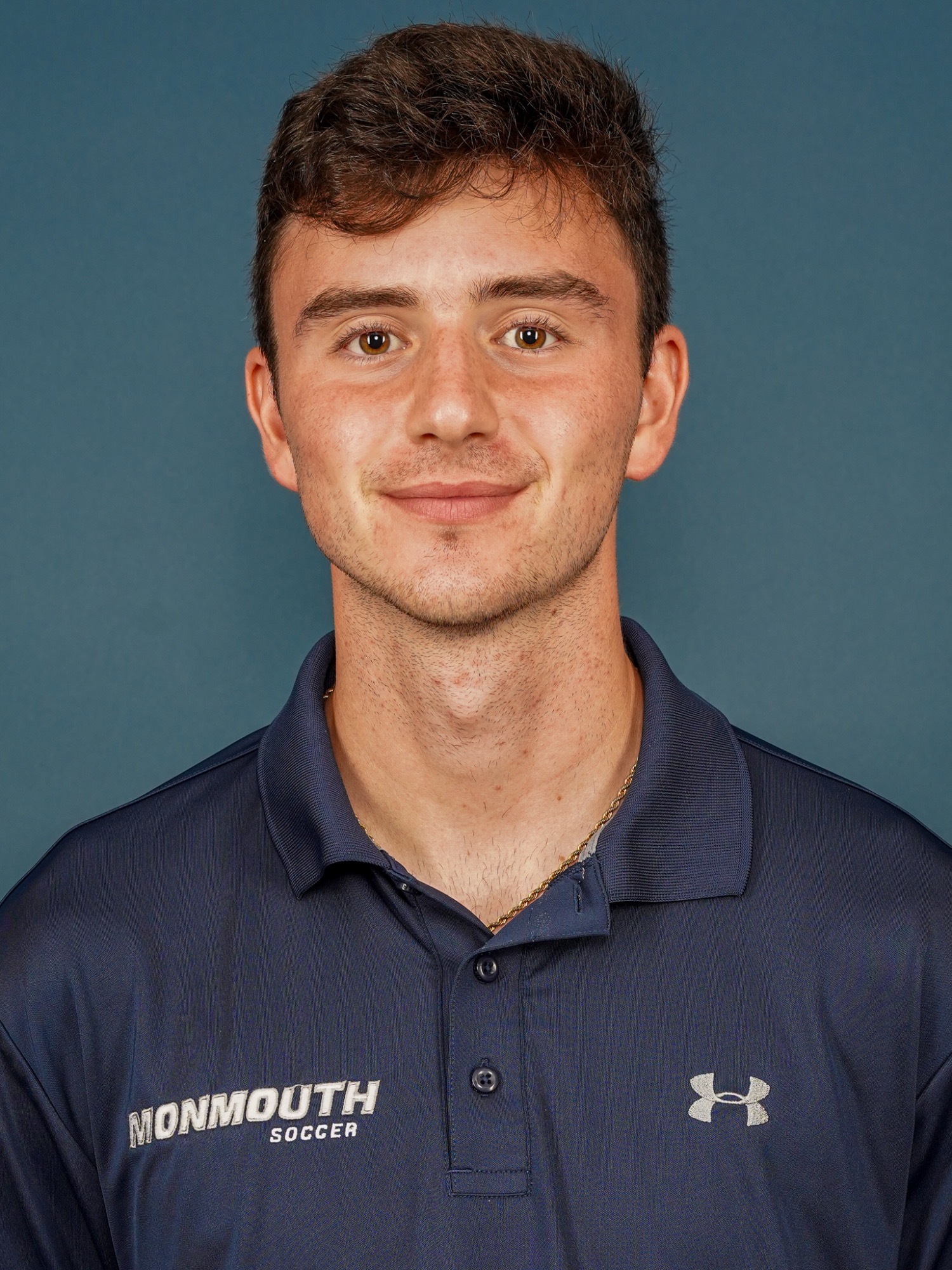 Otto Moosbrugger - Men's Soccer Headshot 2026 (head and shoulders mug shot in blue Monmouth soccer polo)