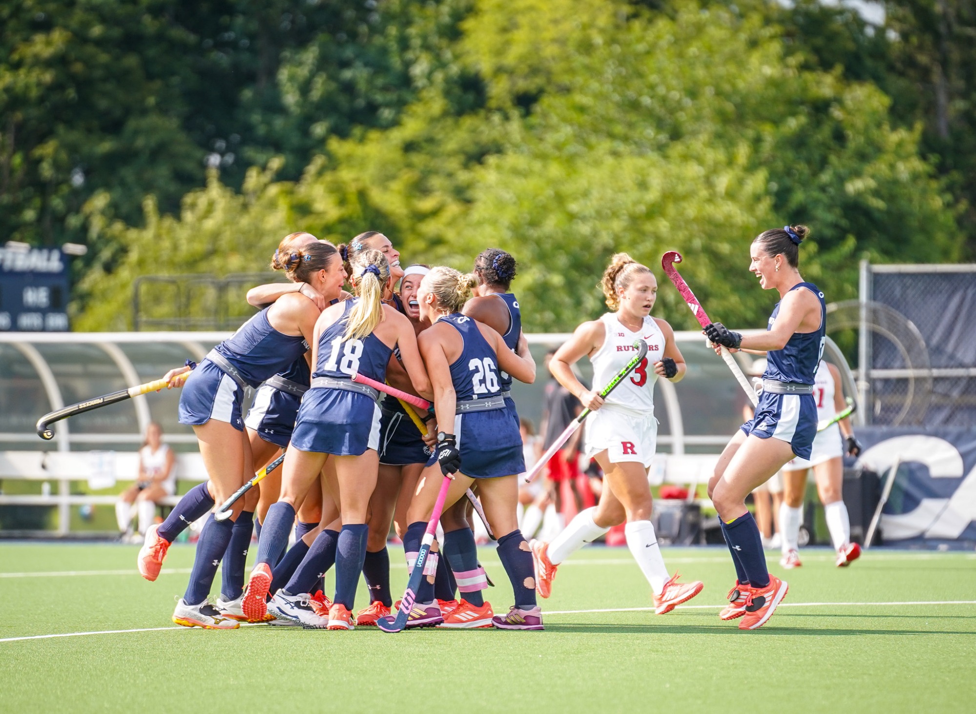 team celebrates after a Milla Frye goal