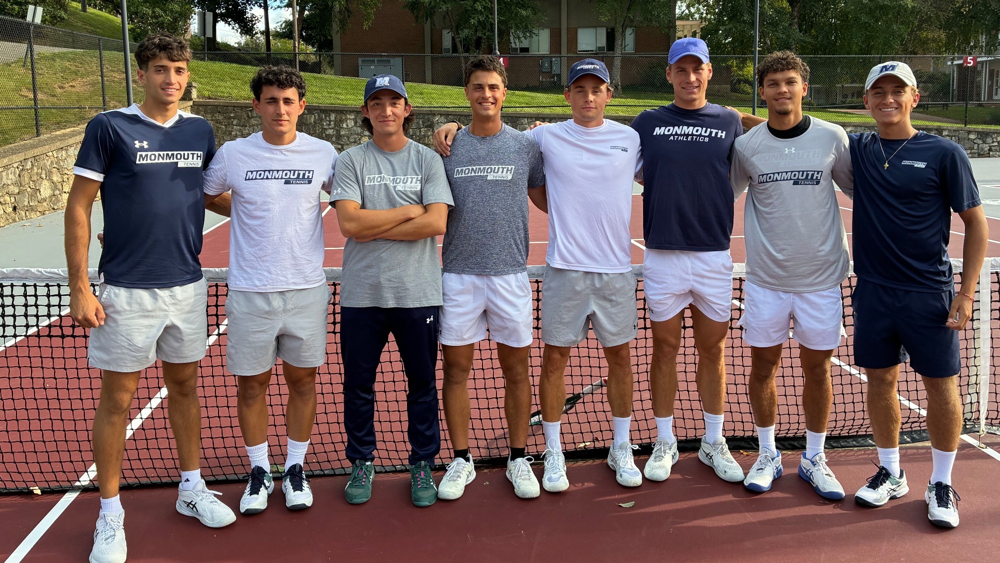 The Men's Tennis Team stands in a row before the 2026-27 opener