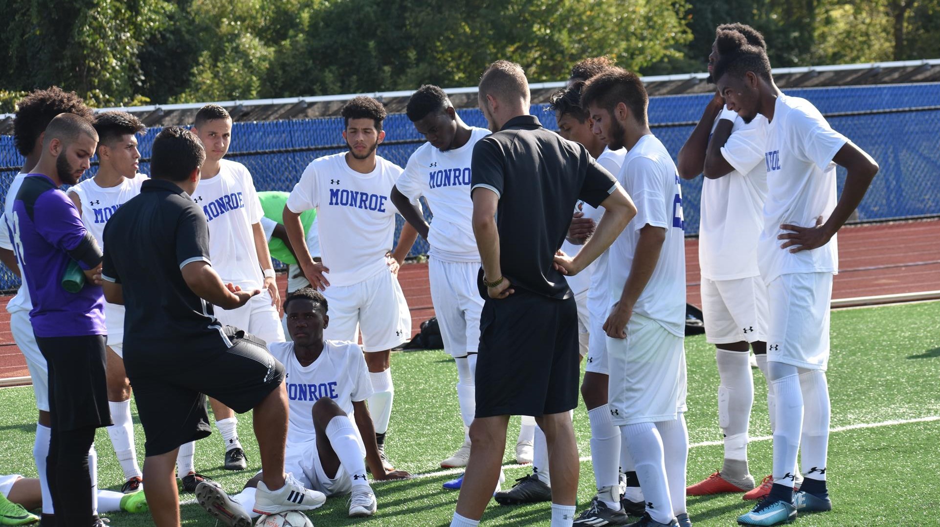 JV Men's Soccer Team Group Huddle