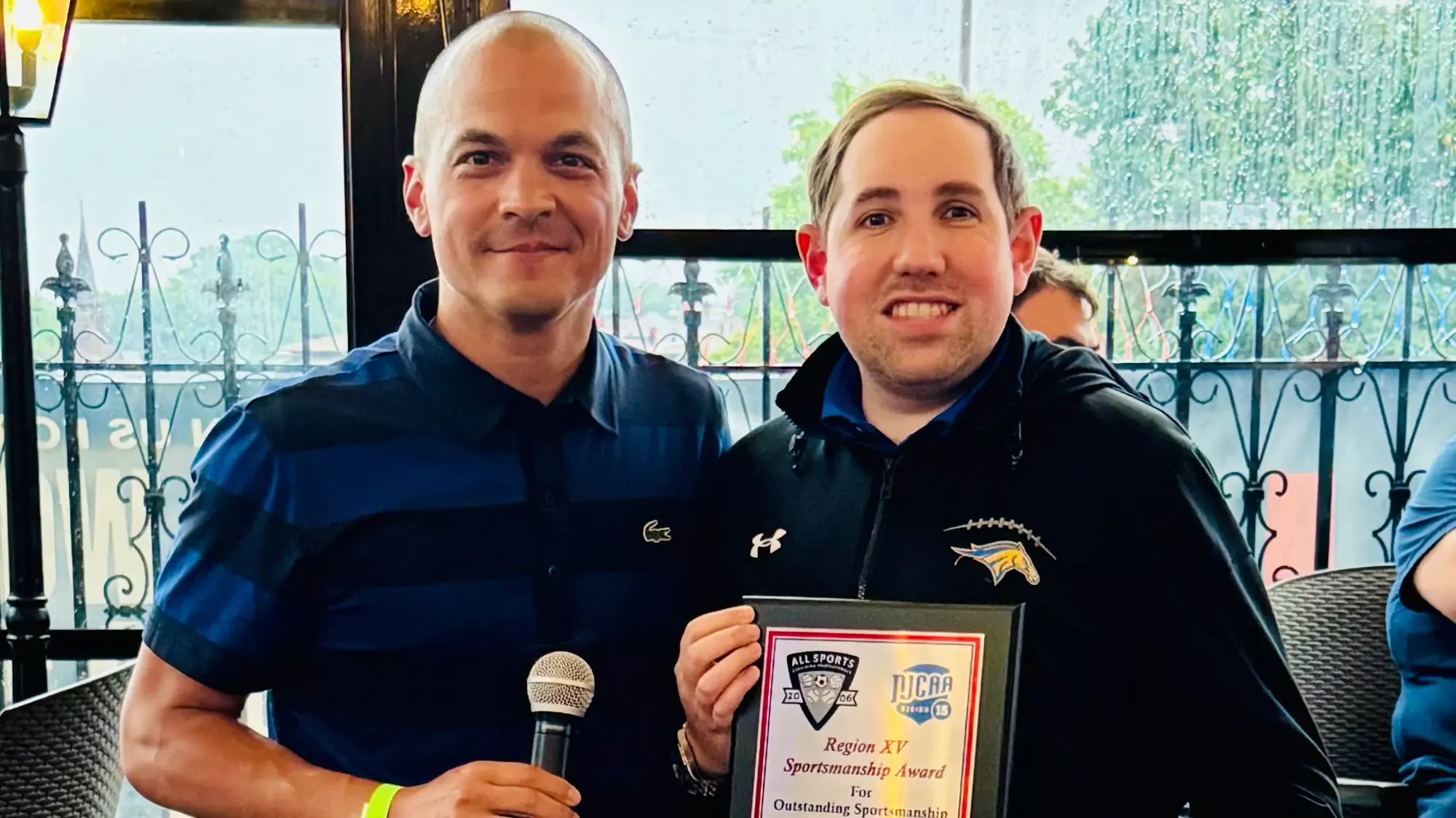 Director of Sports Information Aaron Gaberman was presented with the award by ASAP Co-Owner Brandon Cruz