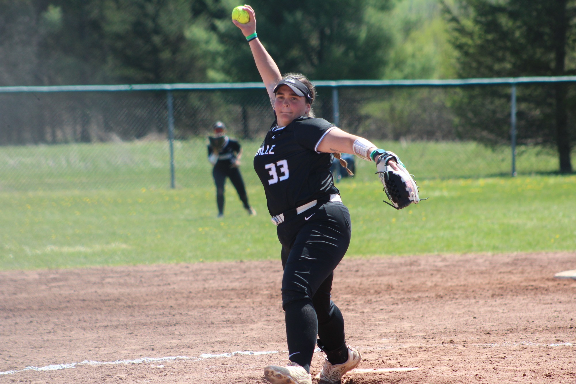 Piper Kaylor throwing a pitch for the Mustangs