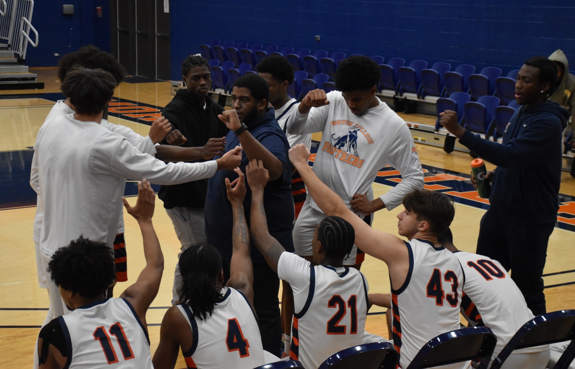 Huddle with head coach Jon Rush