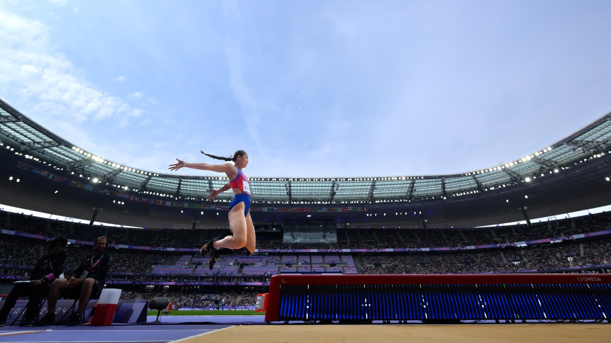 Annie Carey Mid-Leap in the Long Jump at the Paralympic Games