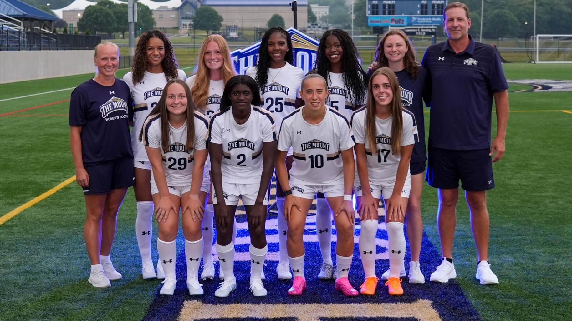 The 2025 Women's Soccer Senior Class with their Coaches