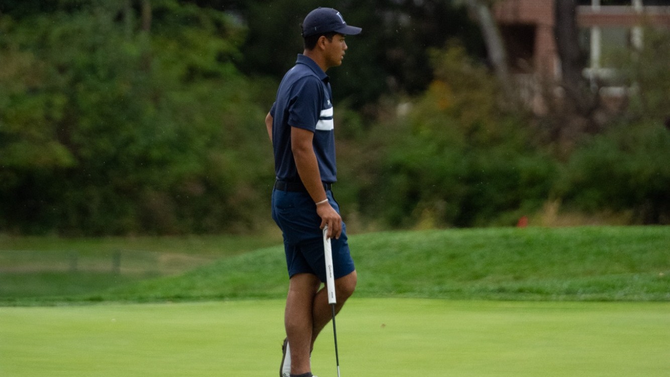 Force Kosalutta Standing with Golf Club Looking at the Green