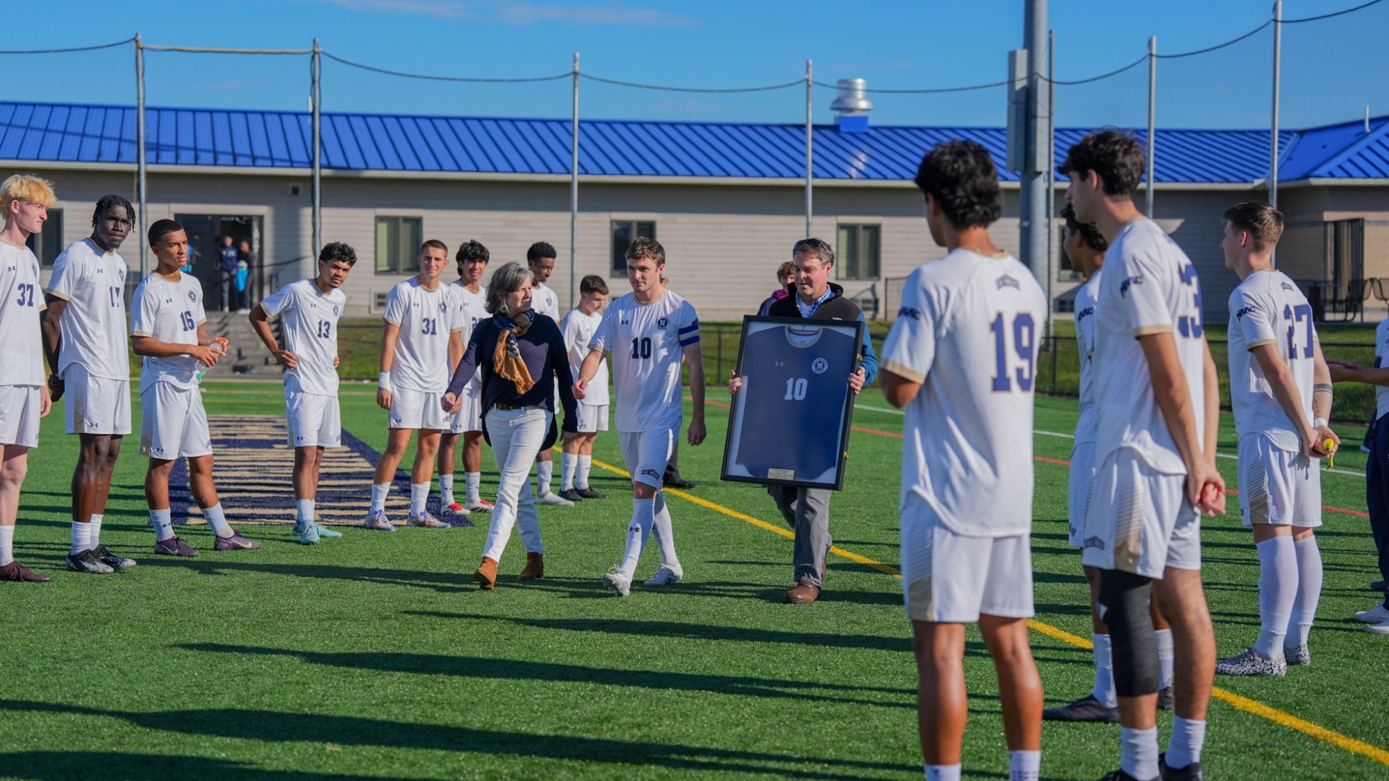 Graham Dougald with his Parents for Senior Day Walkout