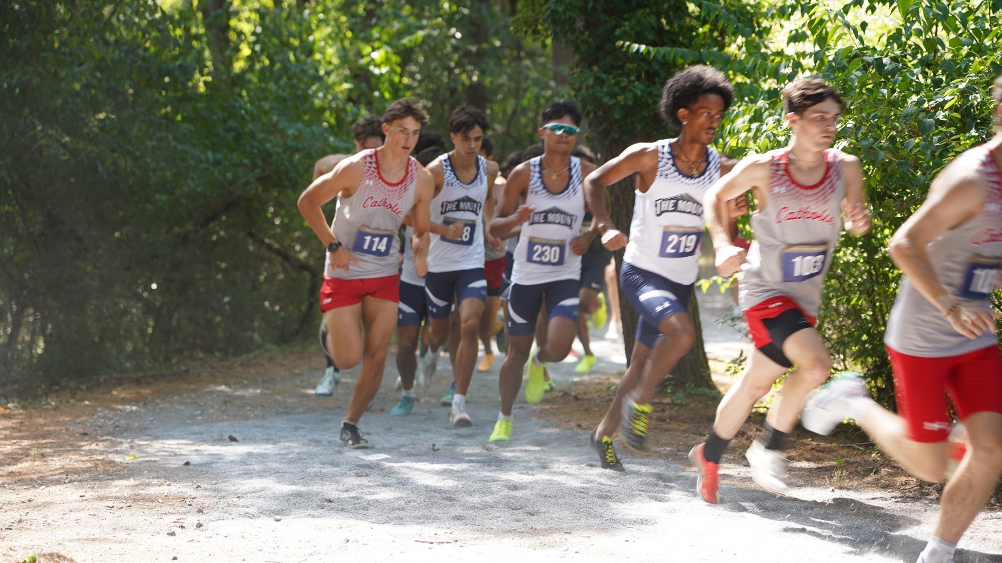 Three Mountaineers Turning the Corner at the 5K Duals 