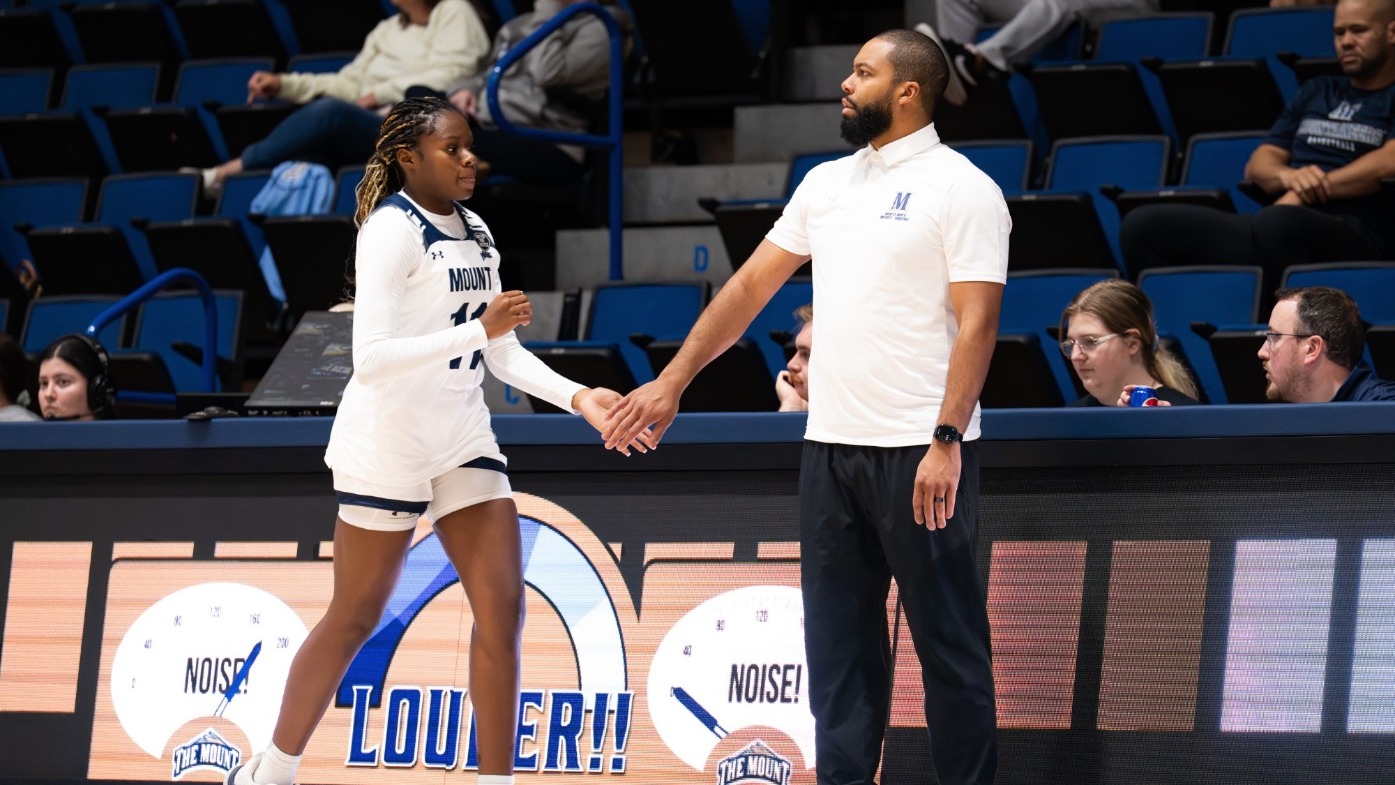 Antoine White Hi-Fives Kayla Lindsey as she Subs Out of the Game