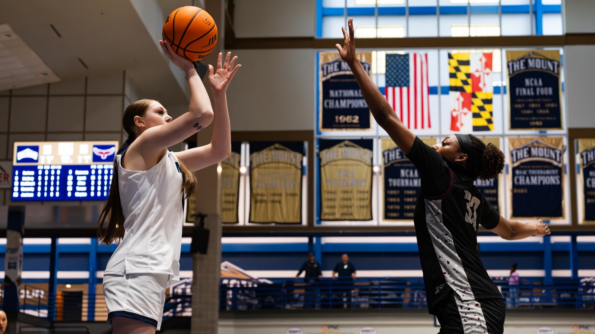 Berlynn Carlson Tries to Floating Jumper over a UMES Player