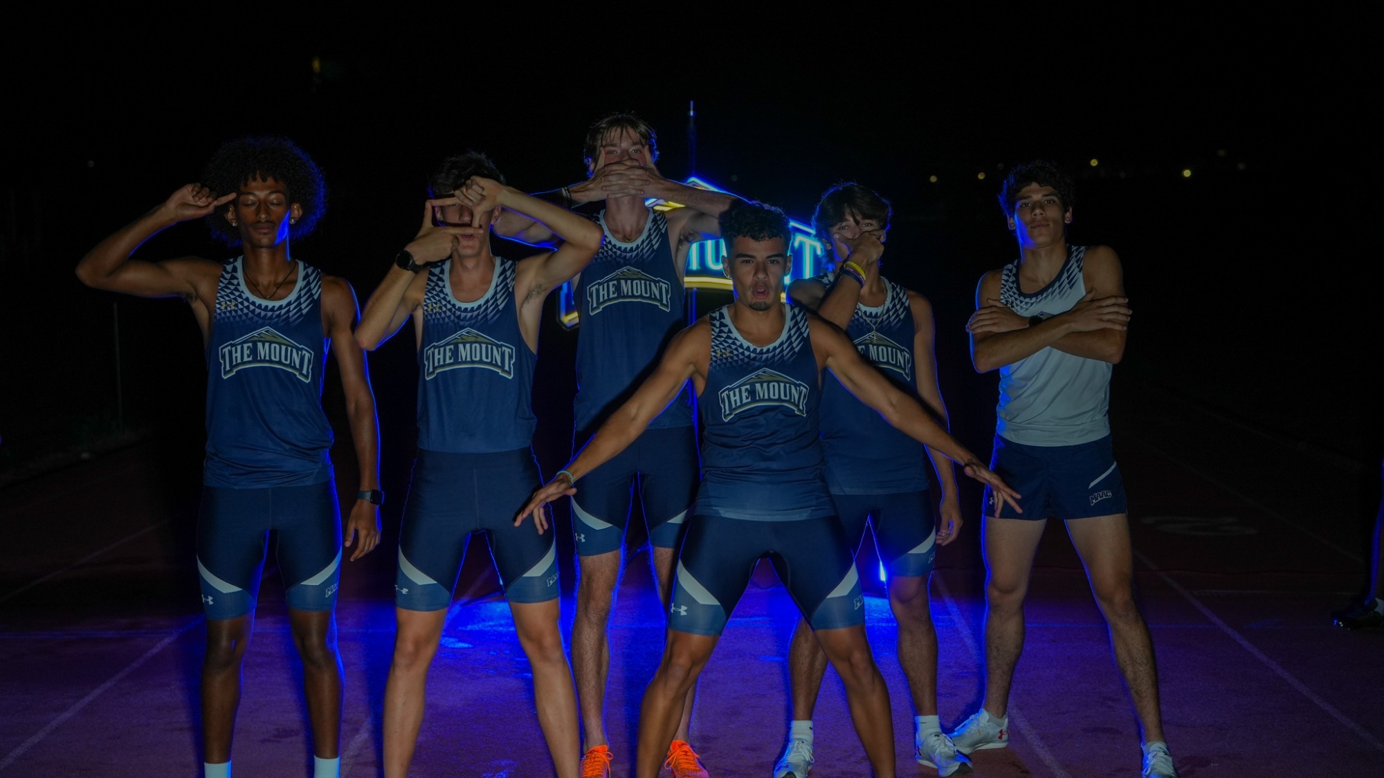 Several Track Athletes Pose at Media Day