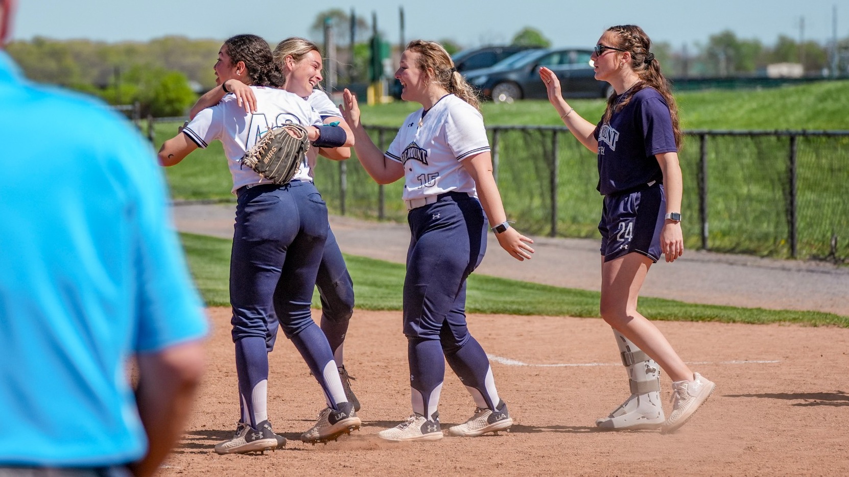 Softball Players Embrace After Clutch Effort