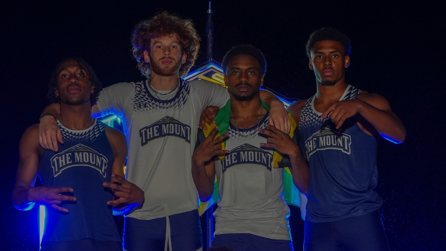 Four Members of the Indoor Track Team Pose at Media Day