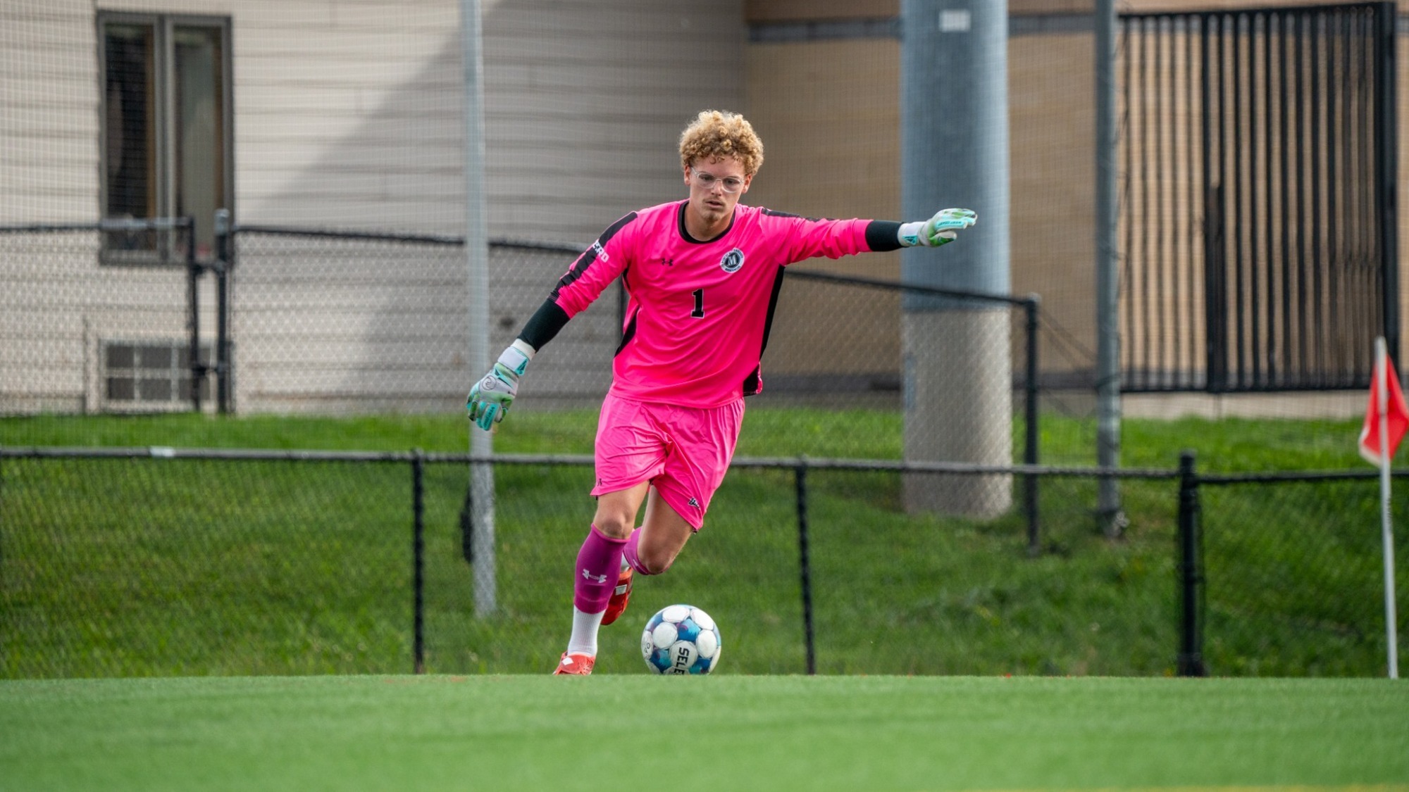 Ryan Collins Runs Up to Strike the Goal Kick