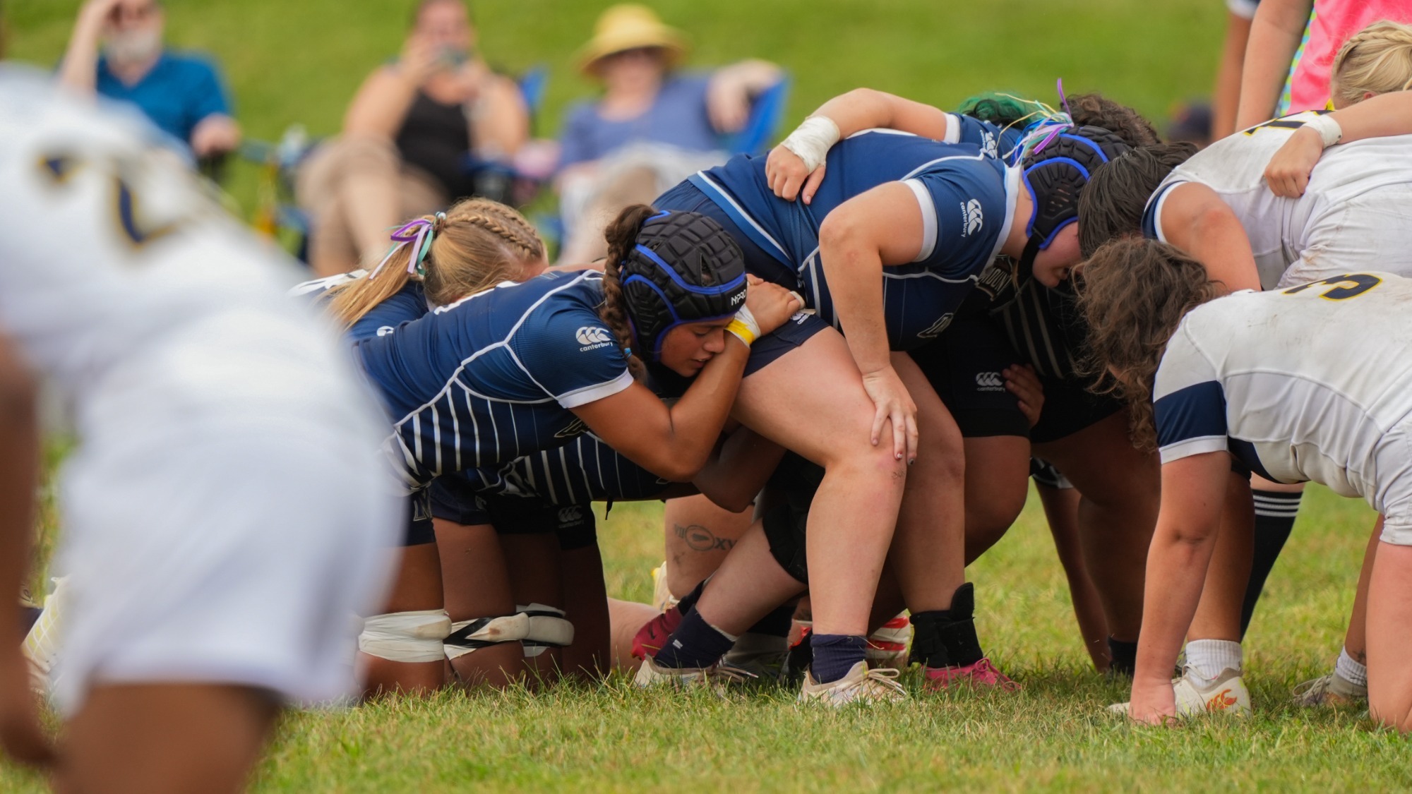 Women's Rugby Players Setting up Scrum 