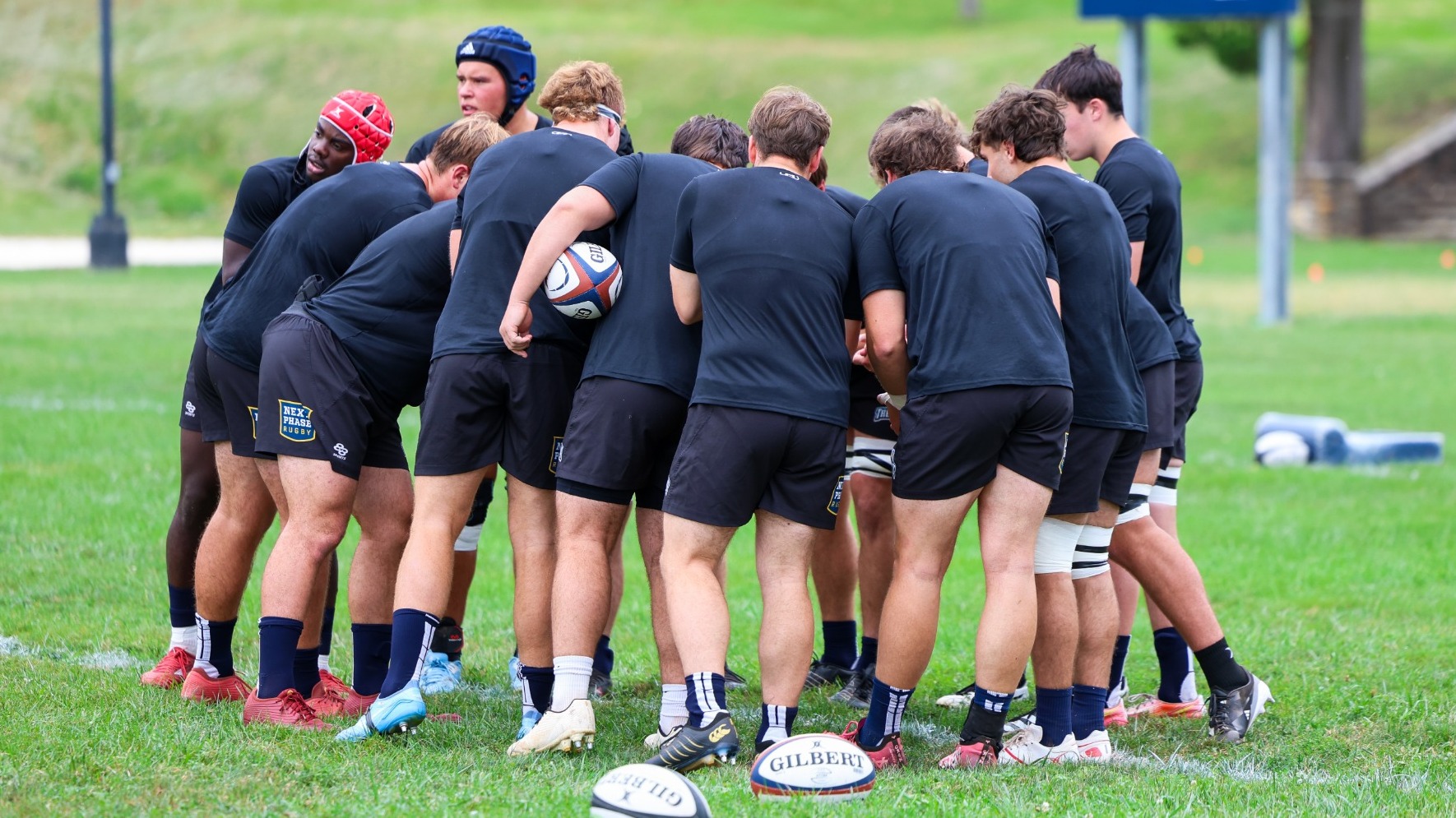 Rugby Players Huddle during a Match