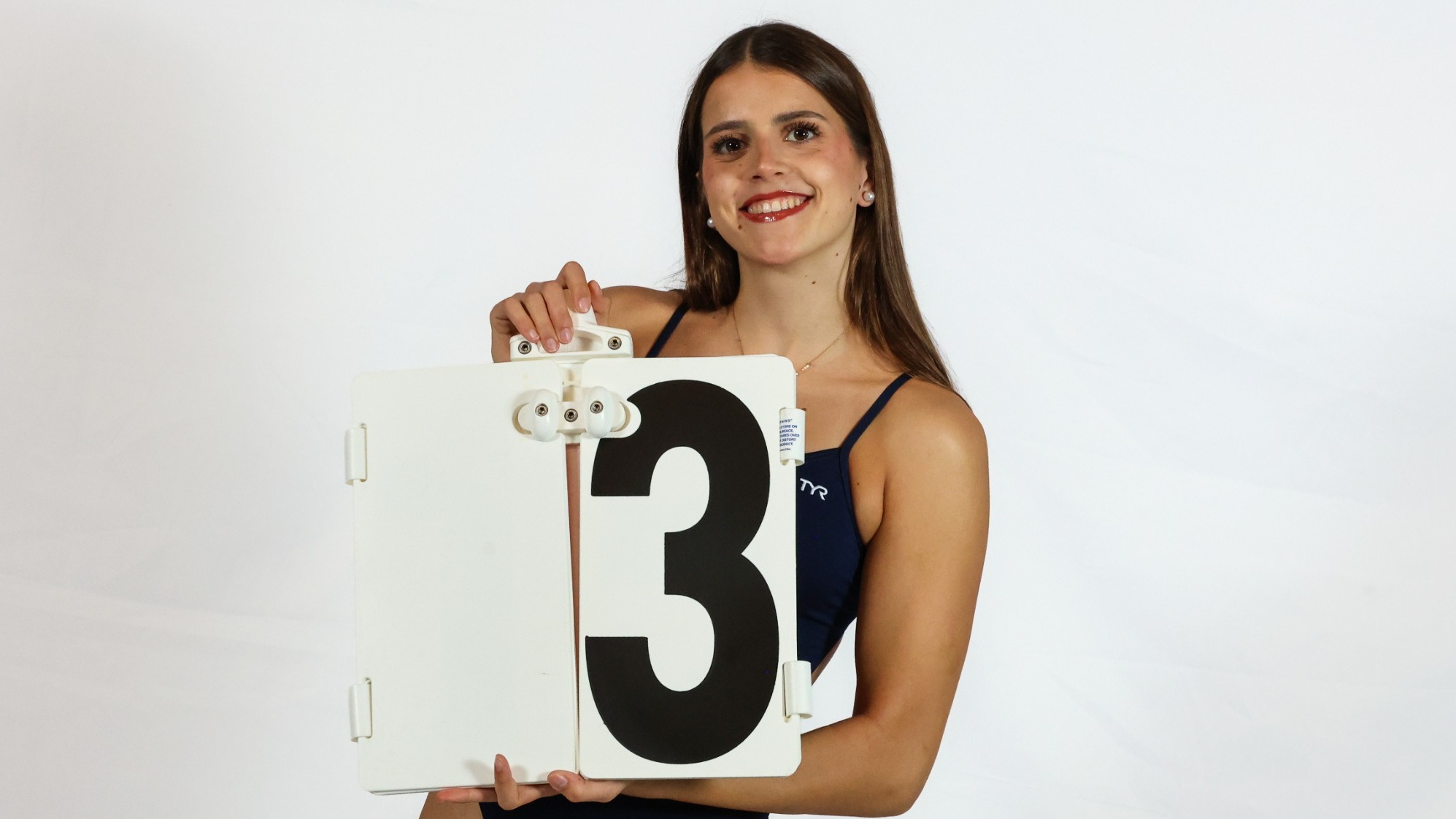 Carmen Del Aguila Holding Lap Sign Media Day Shot