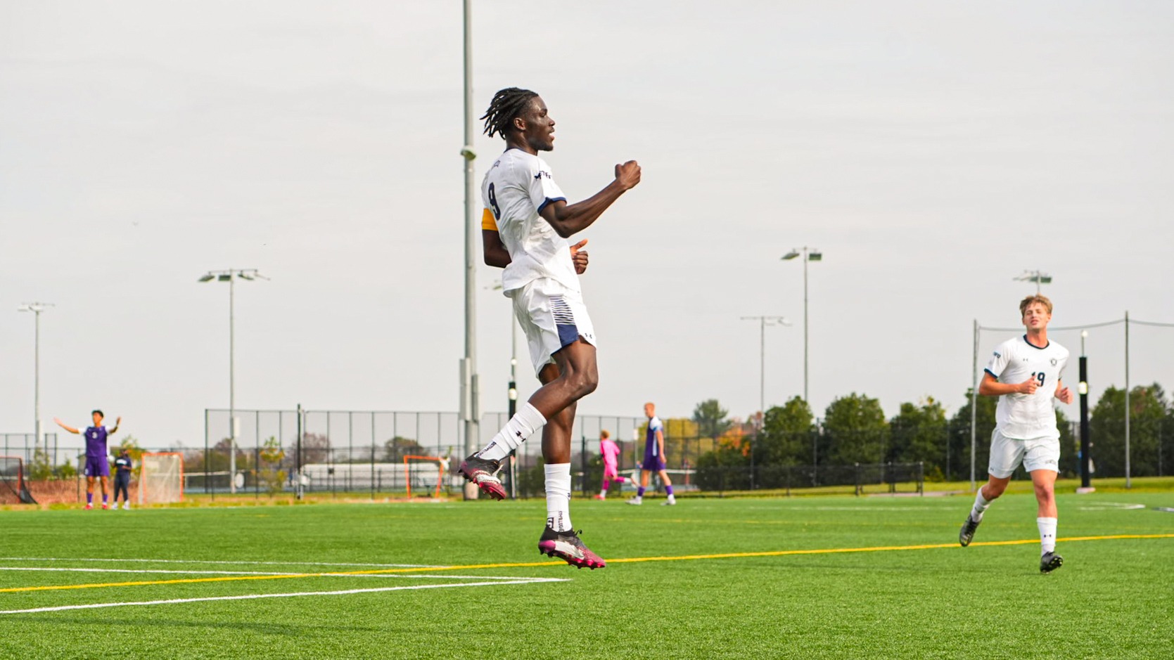 Abou Cherif Fist Pumps in the Air
