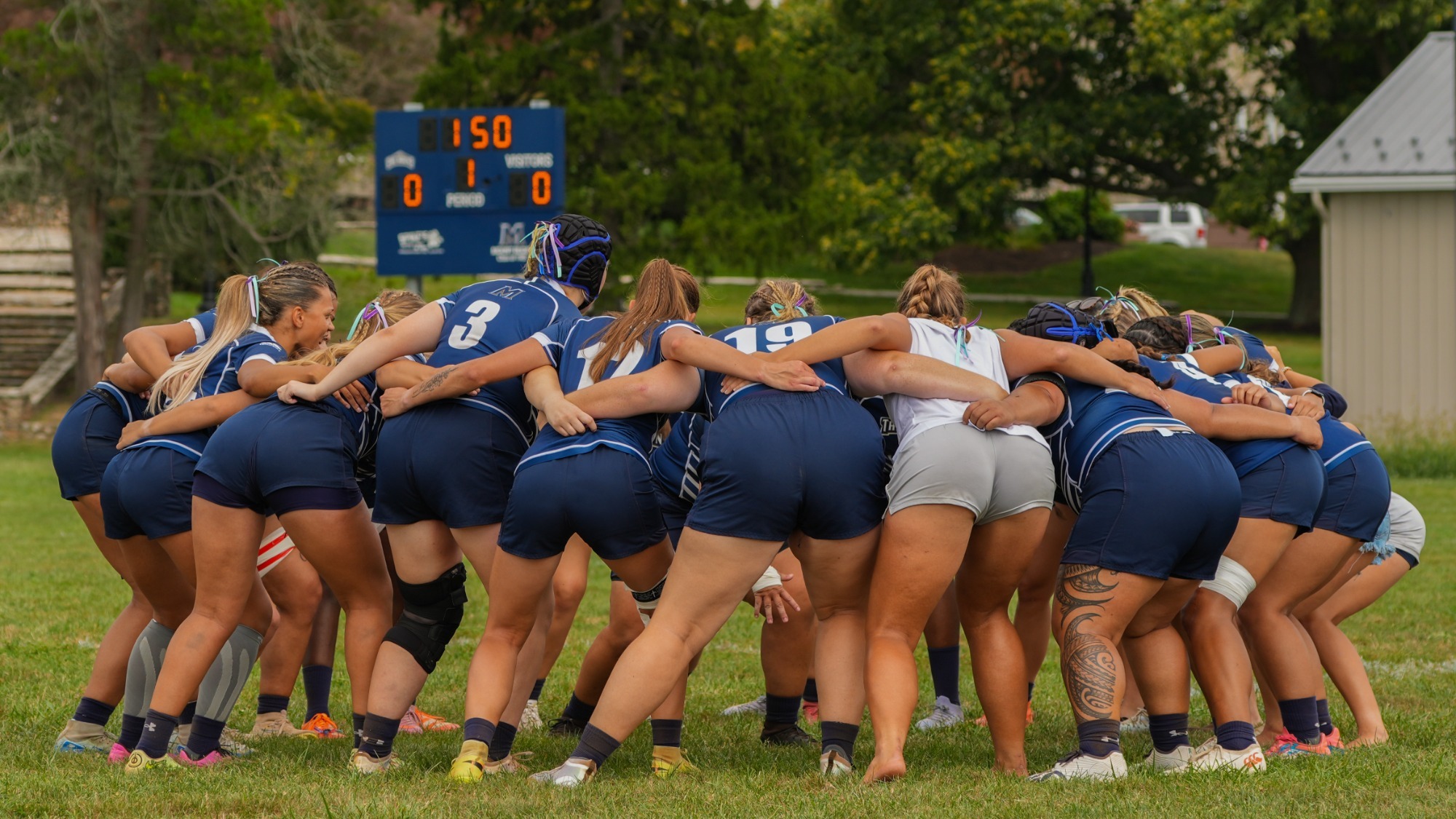 Women's Rugby Team Huddle