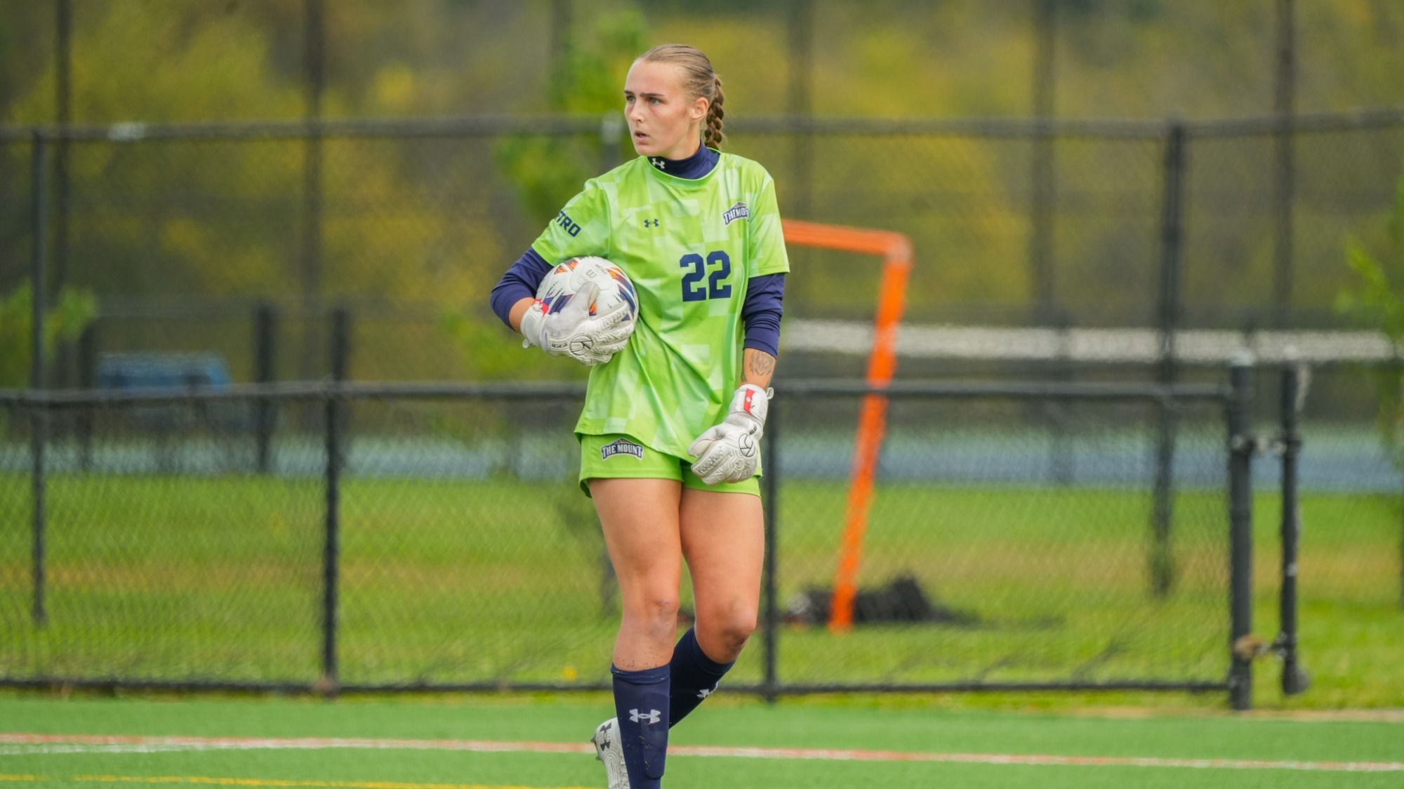 Abby Makela Clutching the Ball and Looking Upfield