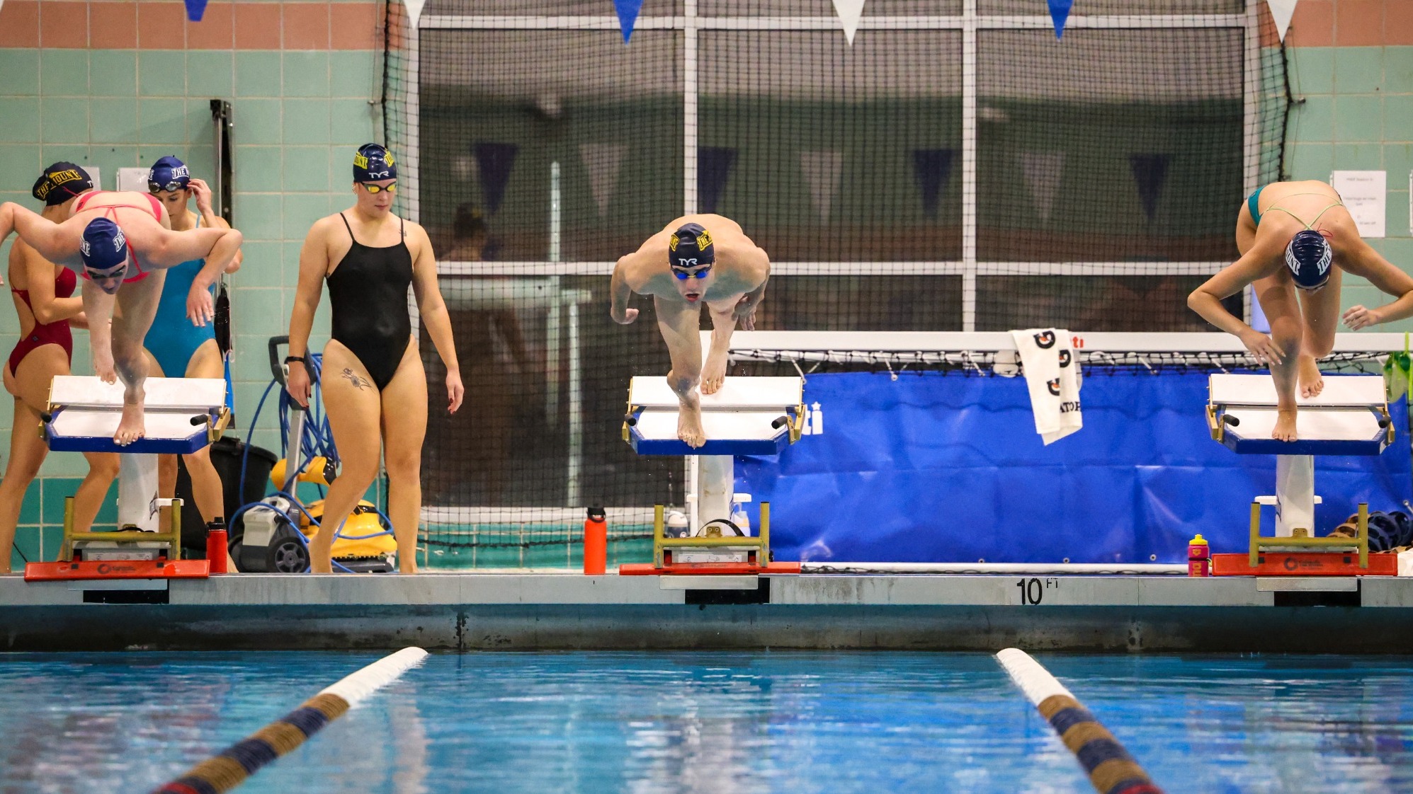 Mount Swimmers Diving Into Pool