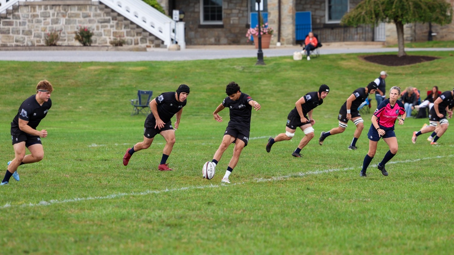 Men's Rugby Charges Towards the Kickoff