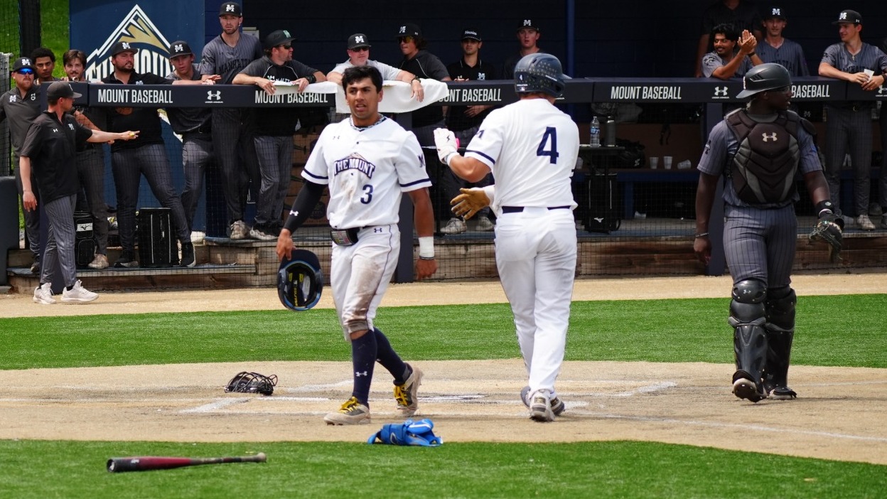 Alex Mendes Crosses the Plate, Passing a Congratulating Bryce Rudisill