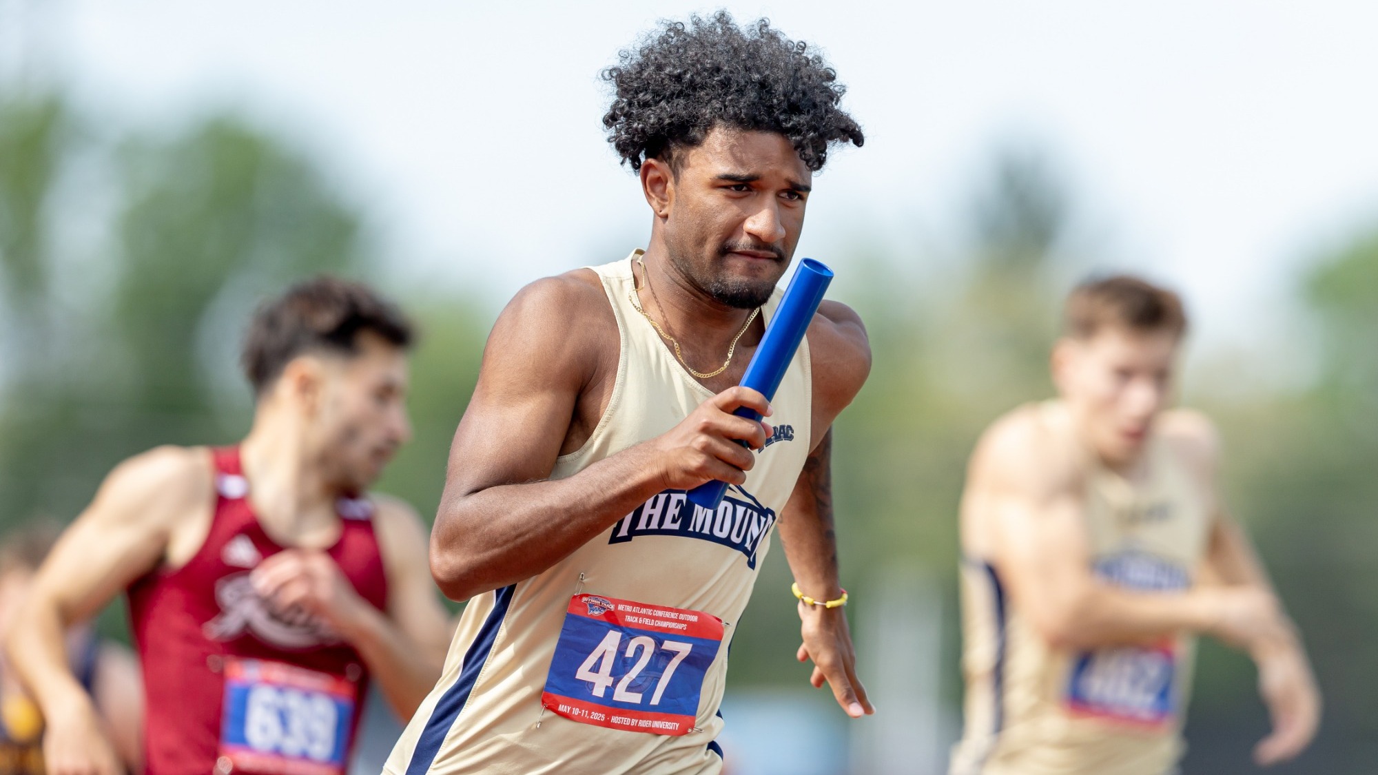 Lucas Koon-Perez Running with the Relay Baton