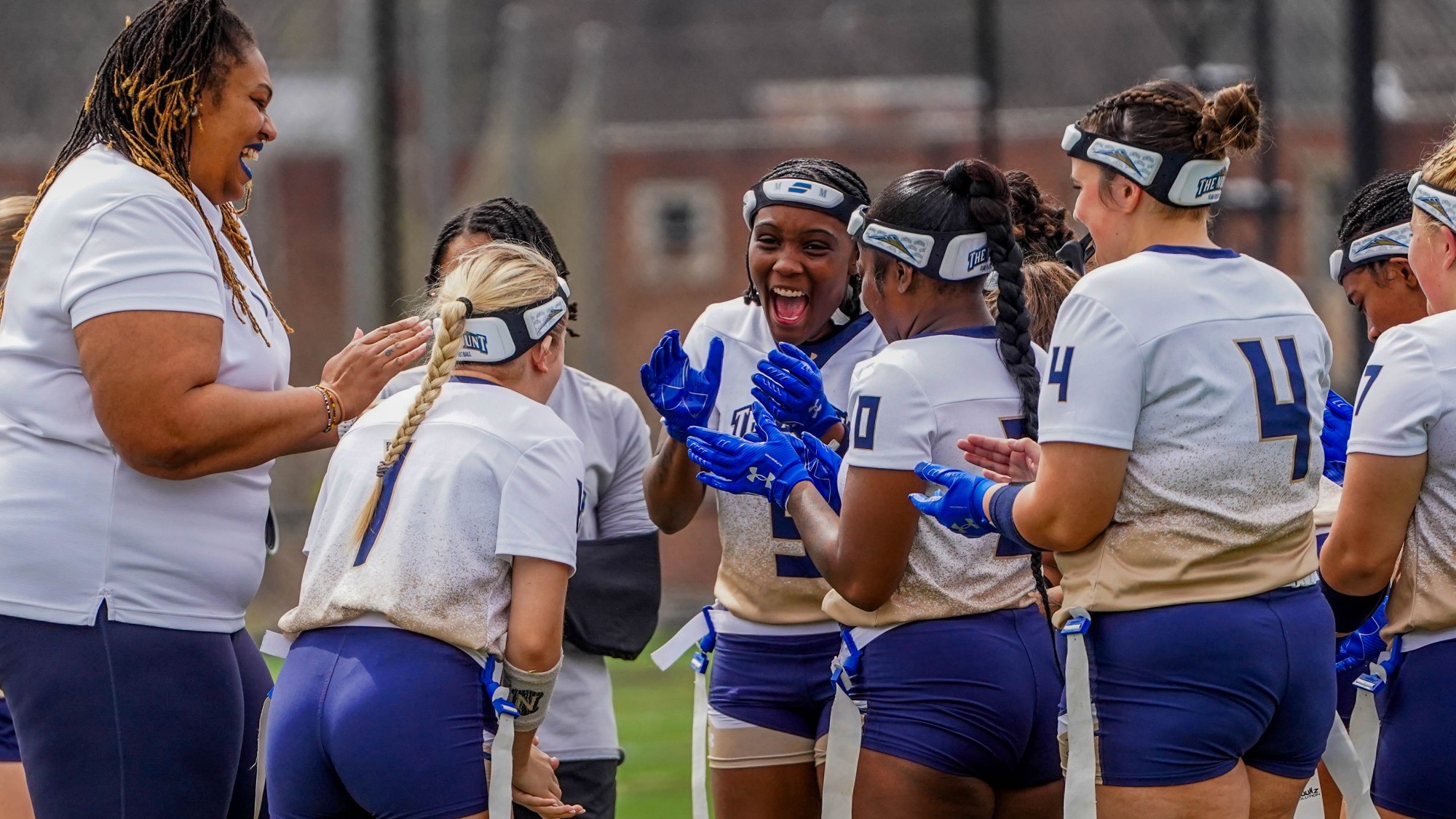Flag Football Cheers in a Team Huddle