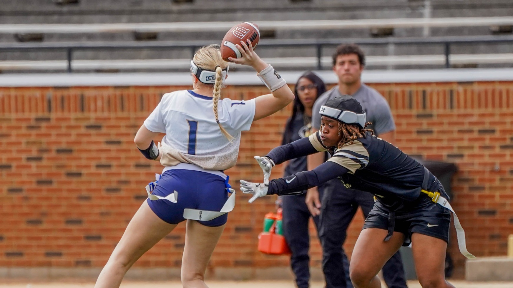 Jenna Dick Looks to Get Off a Pass Before the Defender Pulls the Flag