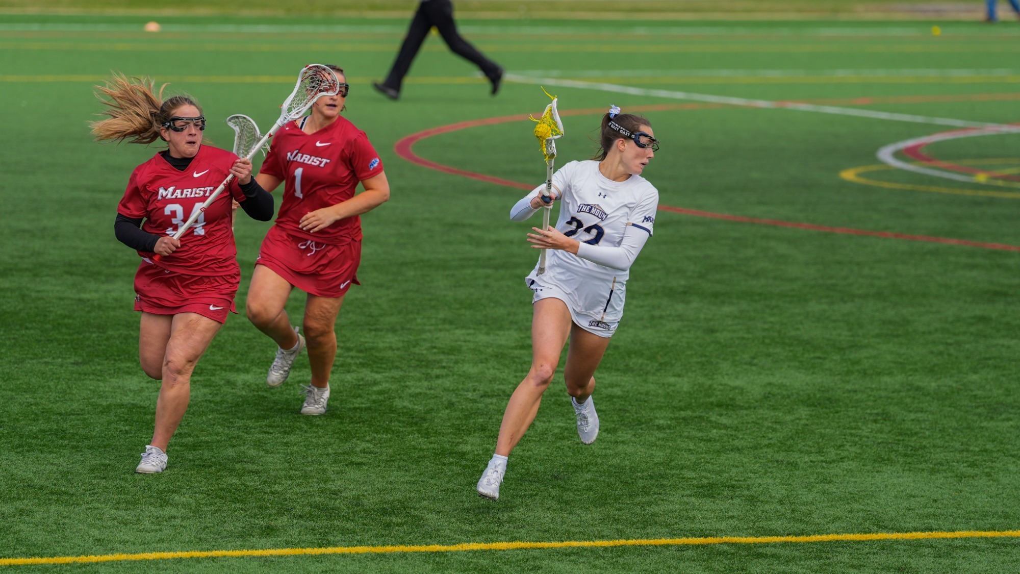 Hailey Chester Evades a Pair of Marist Players