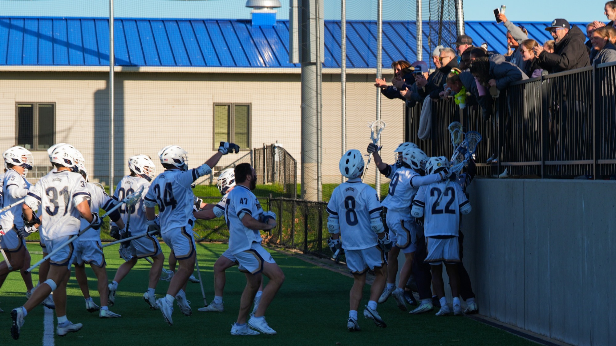 Men's Lacrosse Celebrates Win Over Manhattan