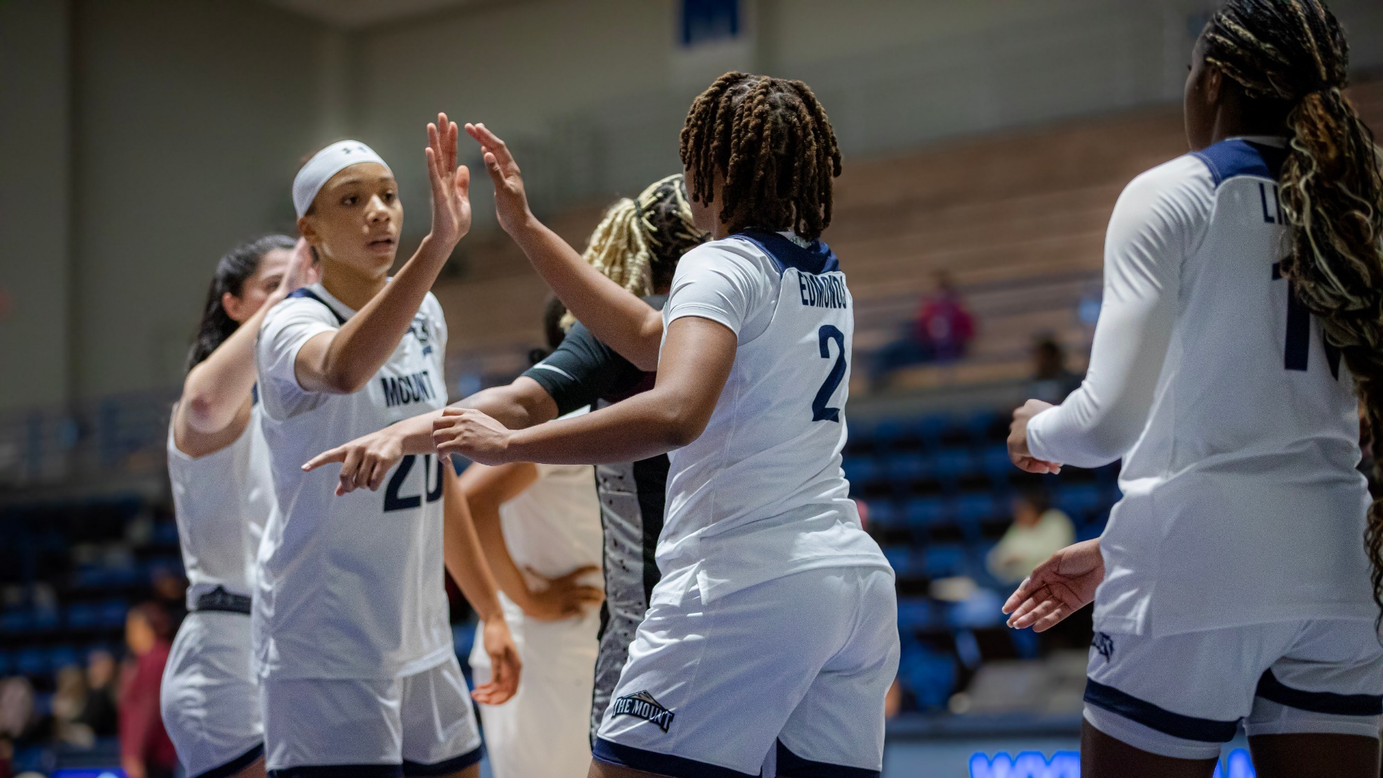 Jaedyn Jamison Hi-Fives Erin Edmonds Following a Play