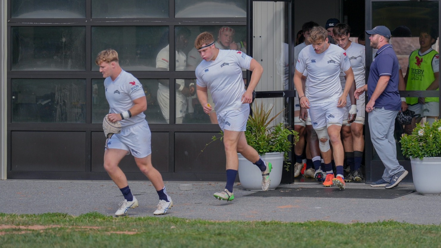 Men's Rugby Players Run Out of the Locker Room